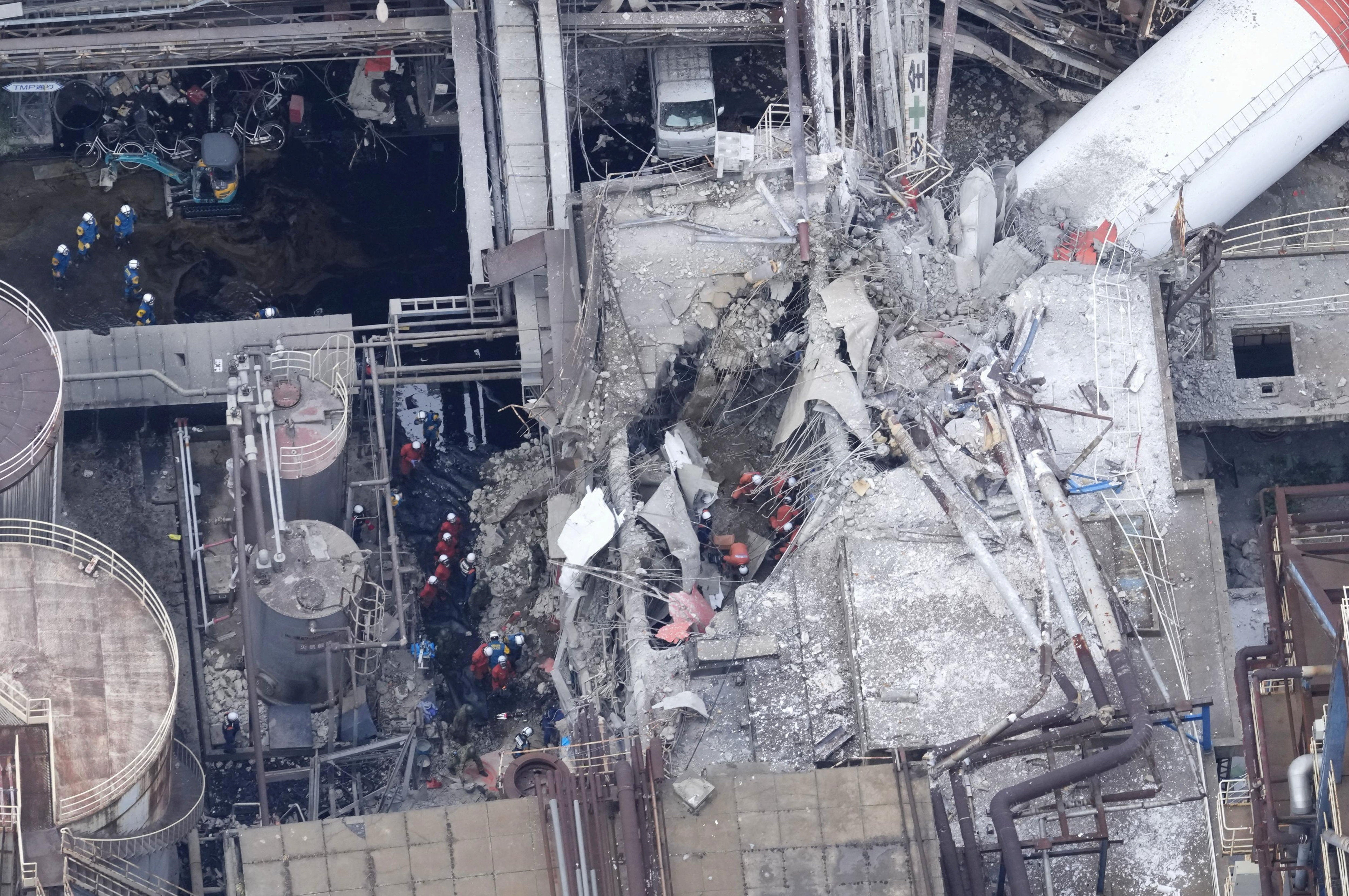 A drone view shows rescue workers at Nippon Paper Industries factory after an earthquake