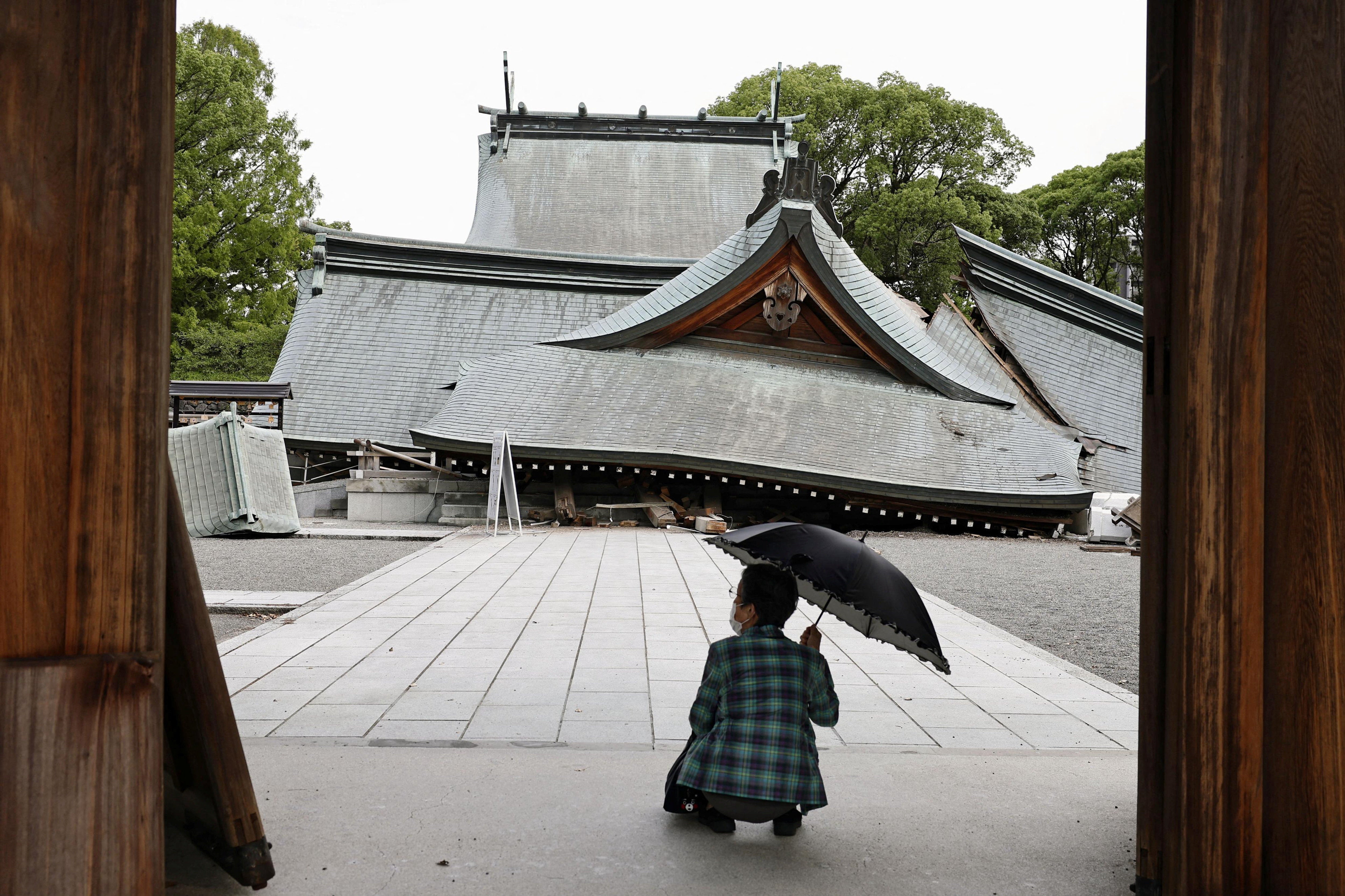 The collapsed worship hall of Yatshushiro Shrine (Reuters)