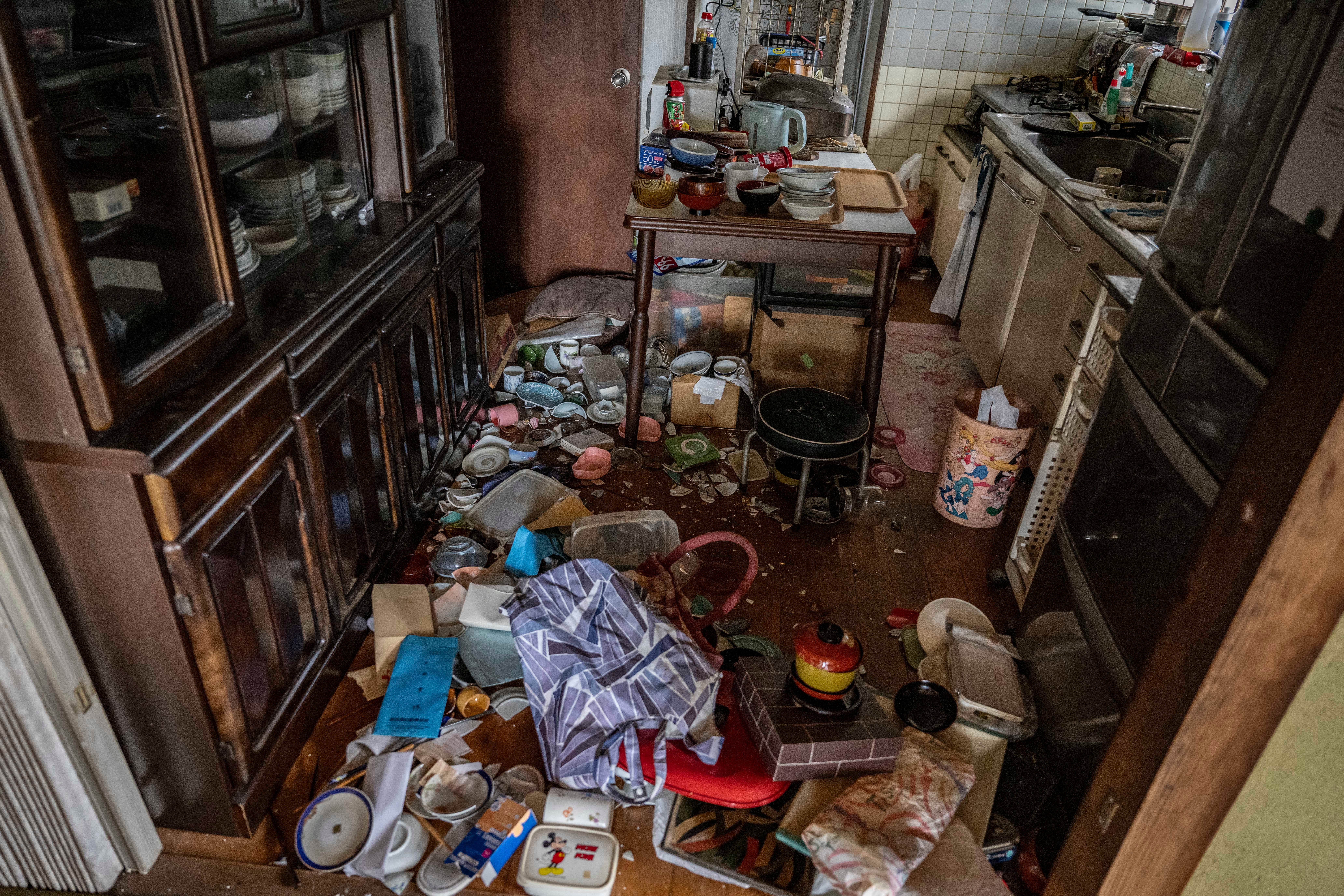 Dishes and other kitchen items are scattered inside the home of Akira Motoda (AFP/Getty)