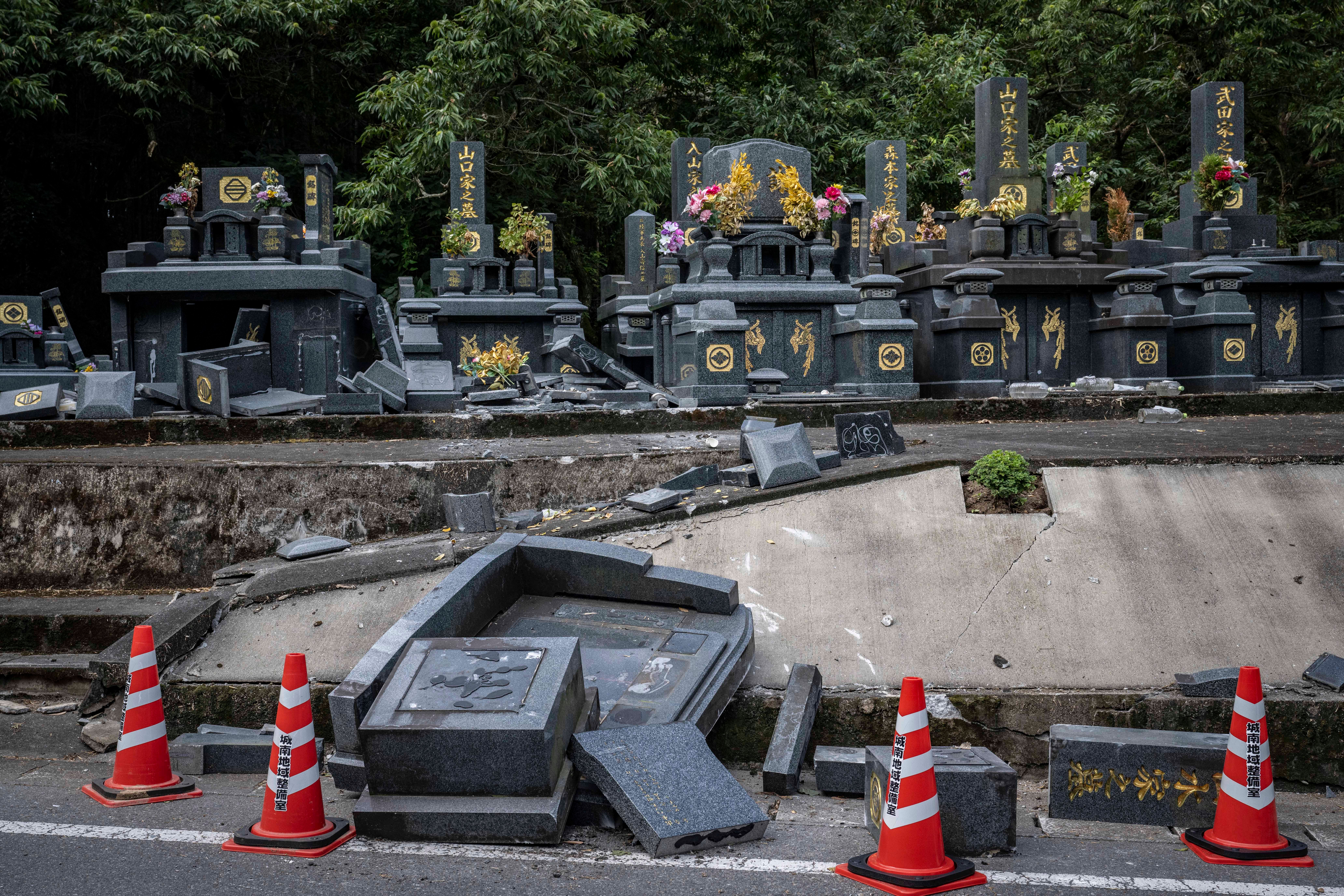 Damaged gravestones are seen in Kumamoto city, Kumamoto Prefecture o (AFP/Getty)