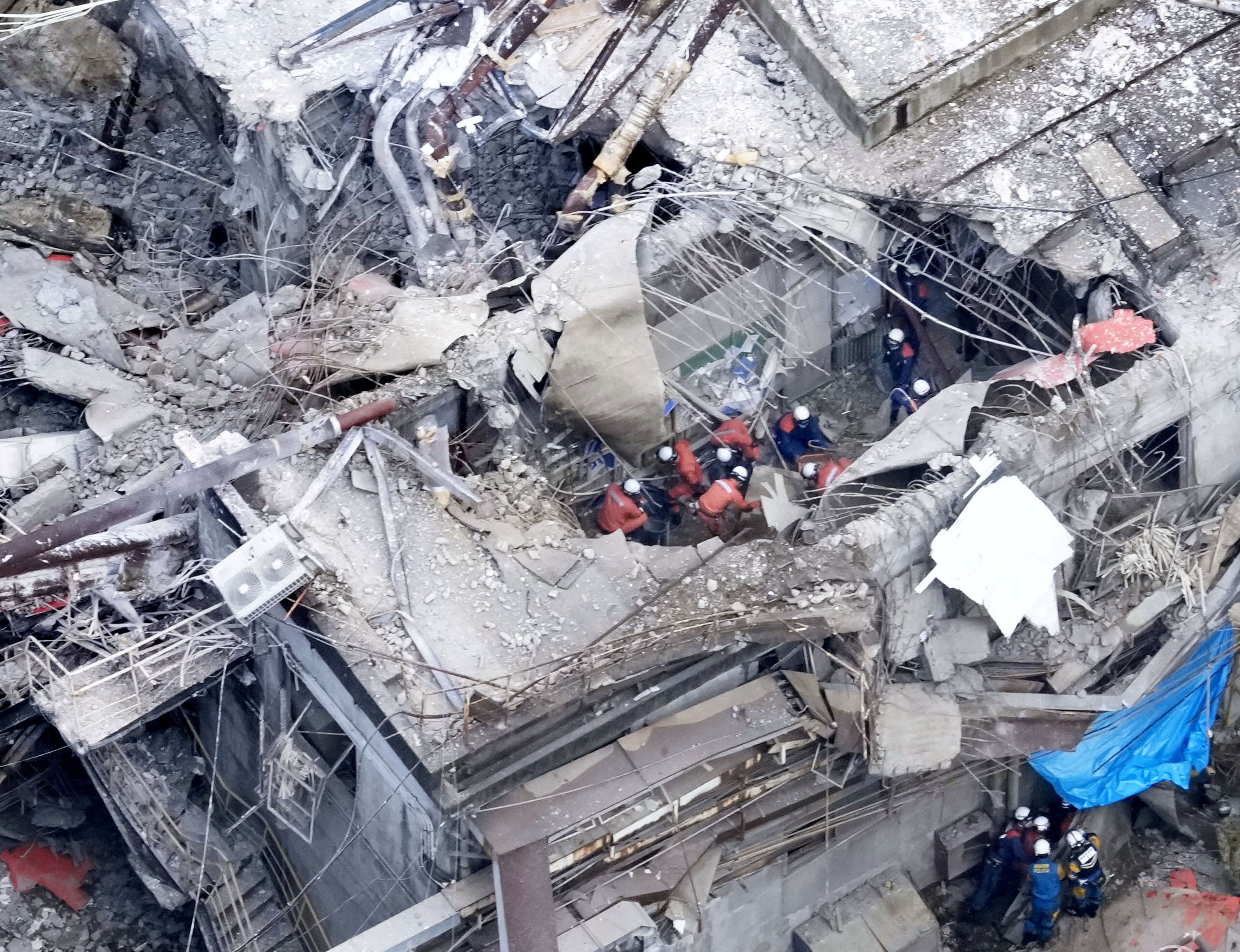 An aerial view shows rescue workers at Nippon Paper Industries factory (Reuters)