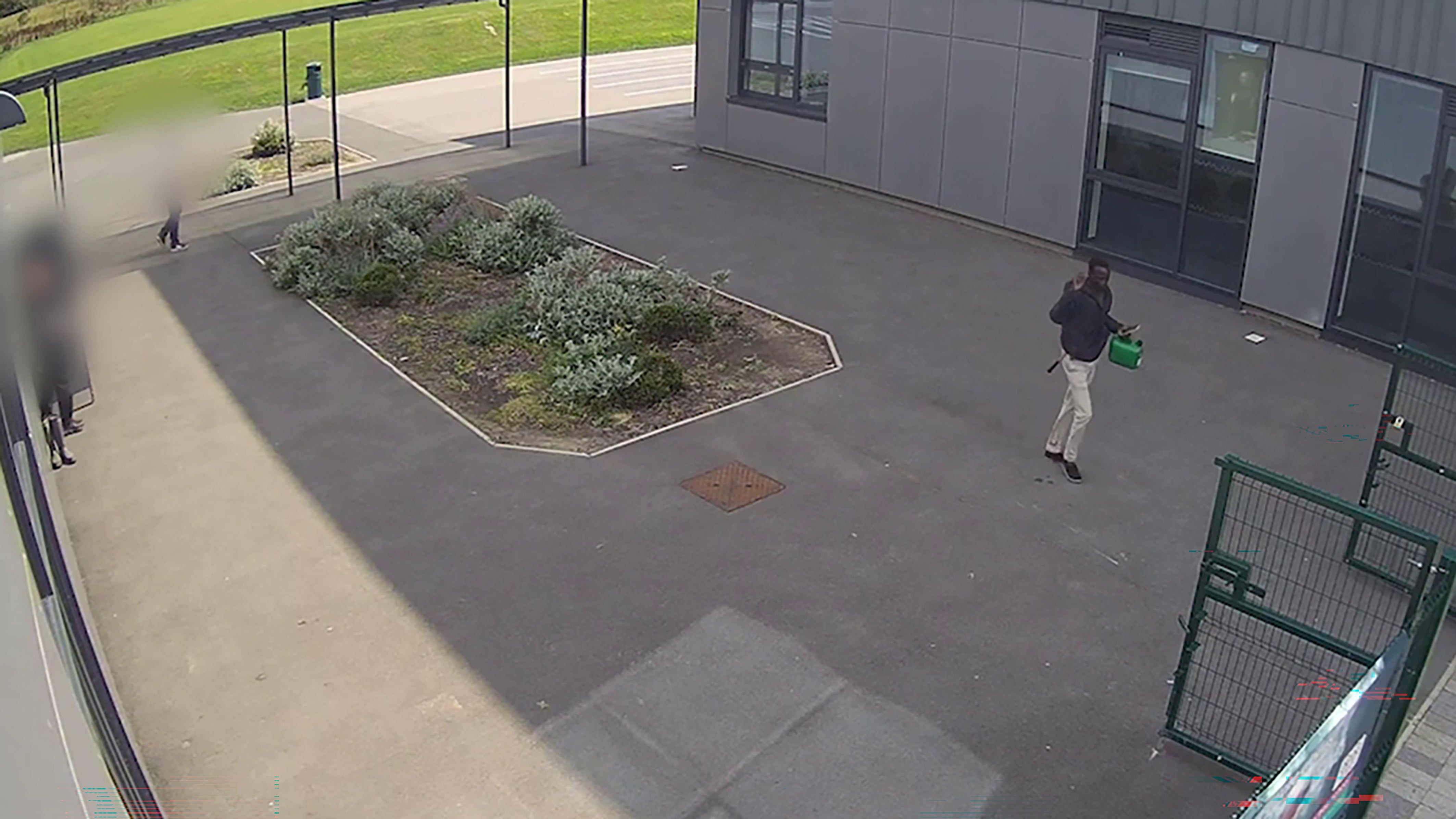 Both Douk Deng inside the grounds of Edgar Wood Academy in Heywood, Greater Manchester (Greater Manchester Police)