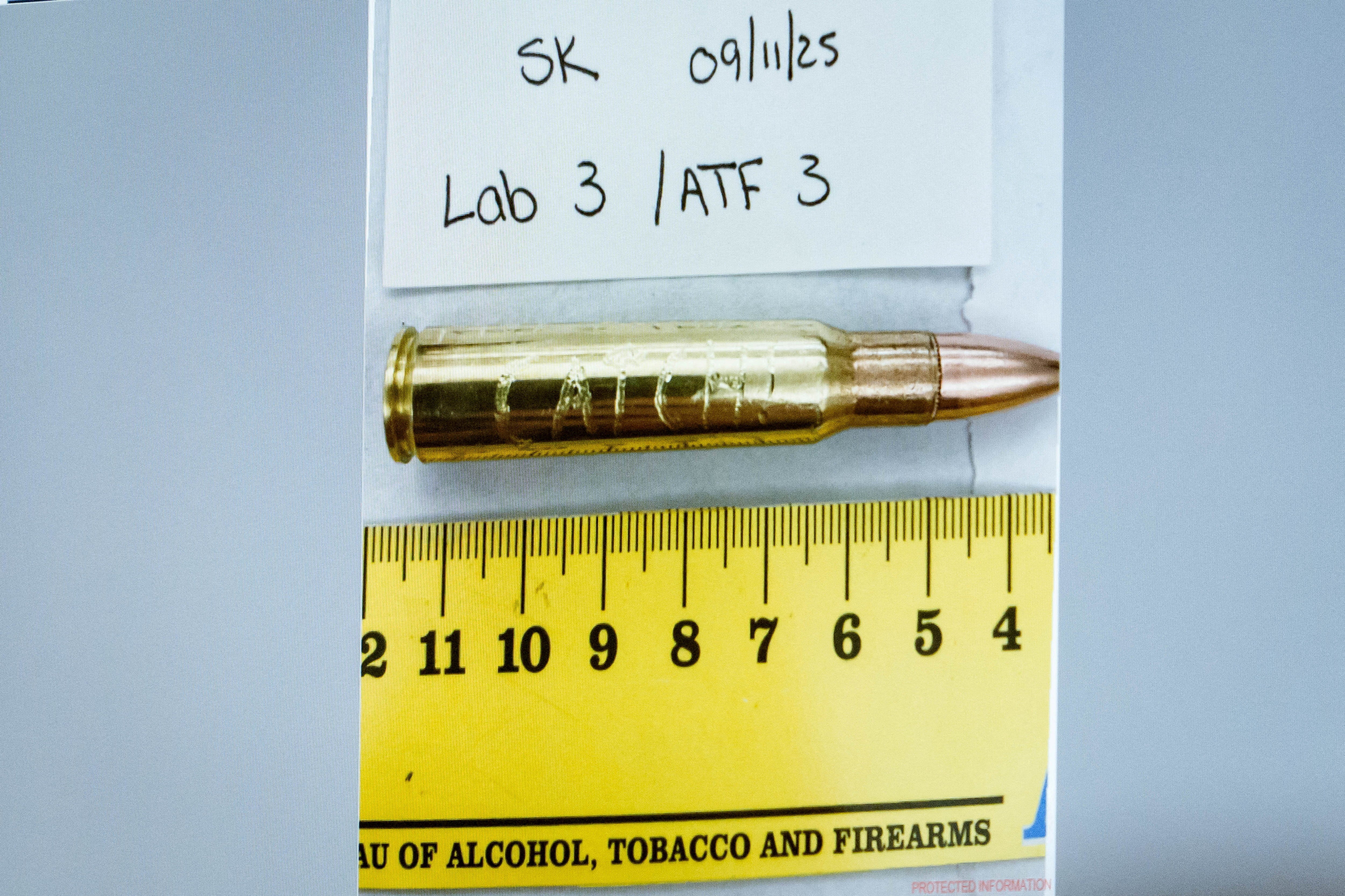 An image of a cartridge engraved with the word “Catch!” is displayed during a preliminary hearing for Tyler Robinson