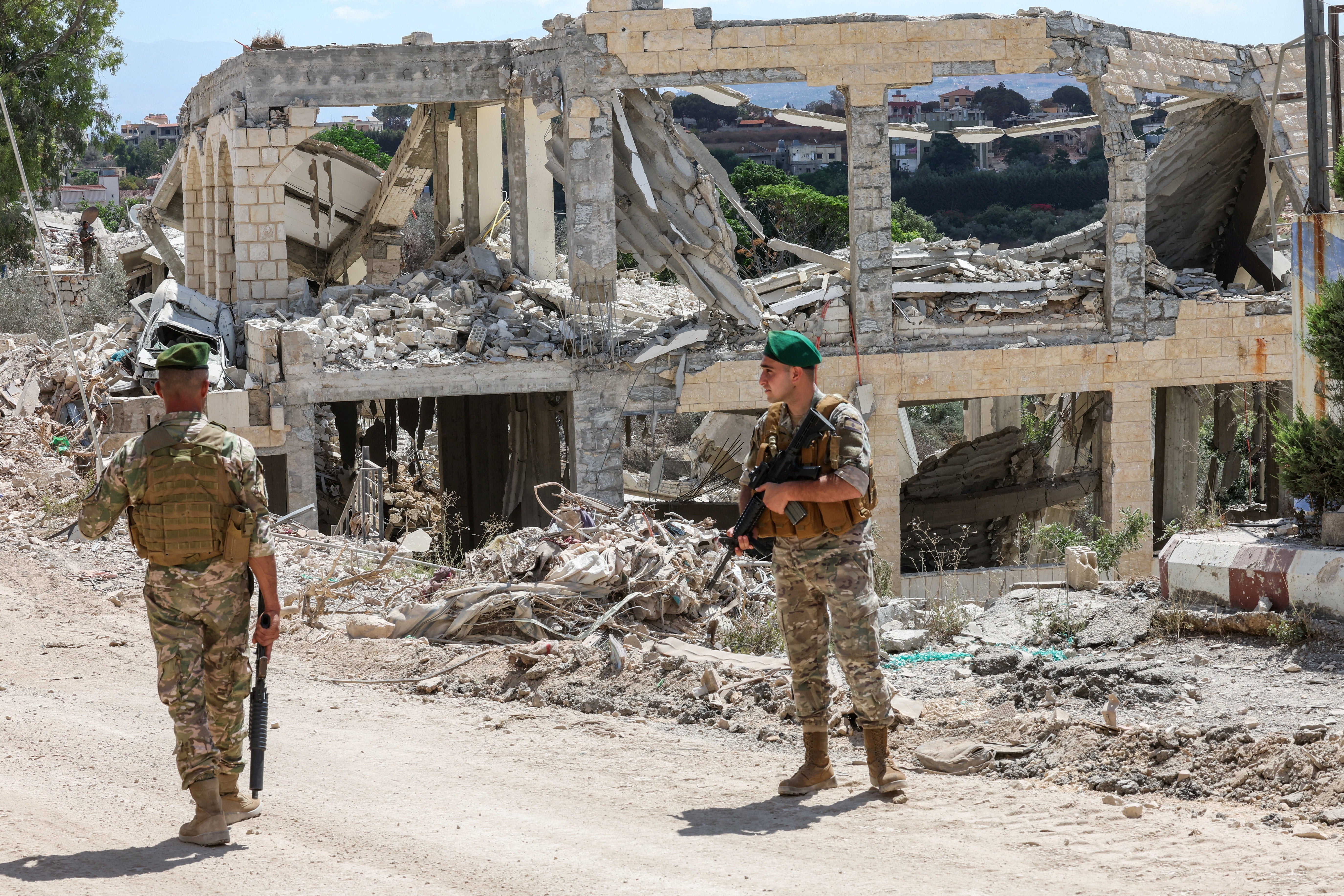 Lebanese soldiers stand guard in the town of Zawtar al-Gharbiyeh, after the withdrawal of Israeli forces under a US-mediated plan, in southern Lebanon (Reuters)