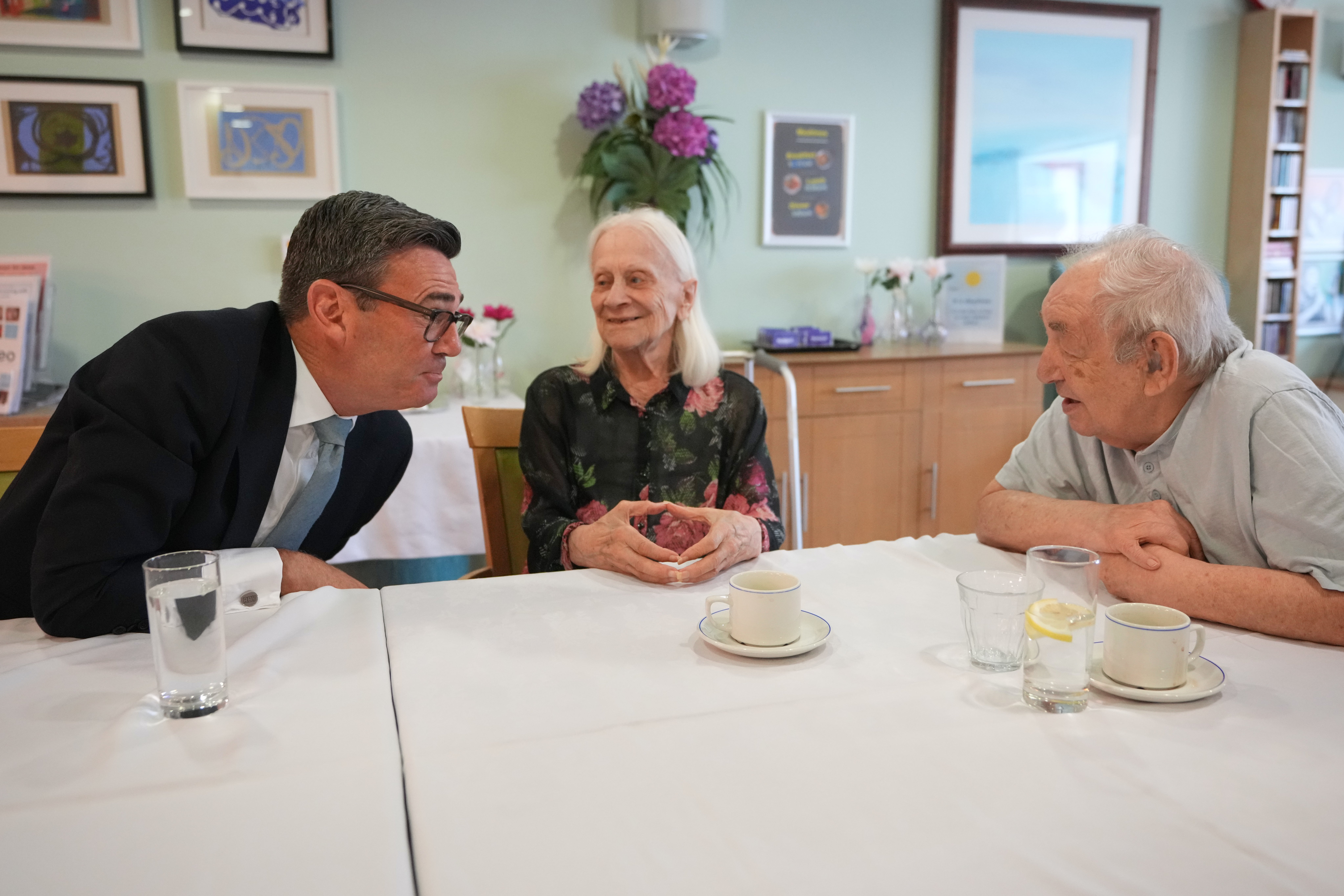 Prime Minister Andy Burnham with residents at the north London care home where he delivered his speech (Kirsty Wigglesworth) (PA Wire)