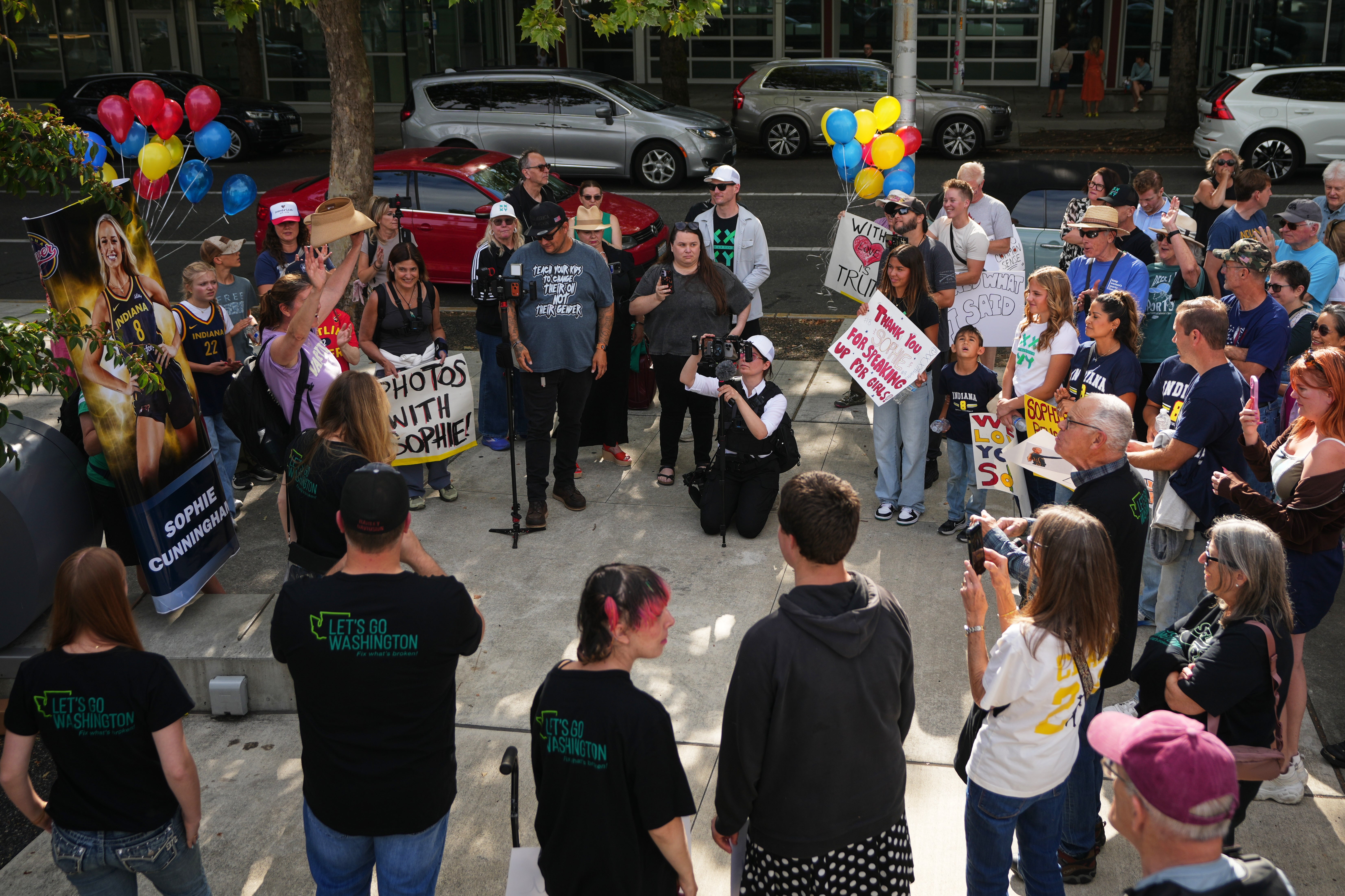People rally to support Indiana Fever guard Sophie Cunningham after her comments on transgender athletes in women's sports (AP)