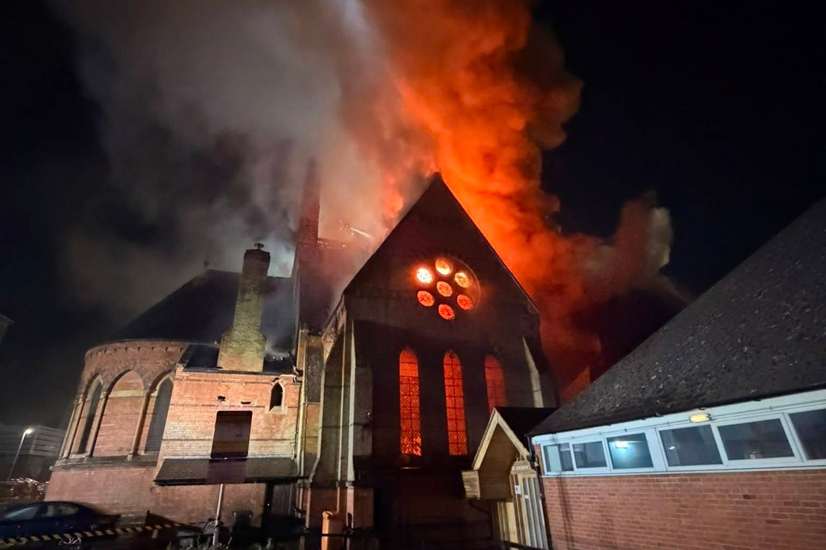 Firefighters rush into burning church to rescue coffin from devastating fire Firefighters rush into burning church to rescue coffin from devastating fire