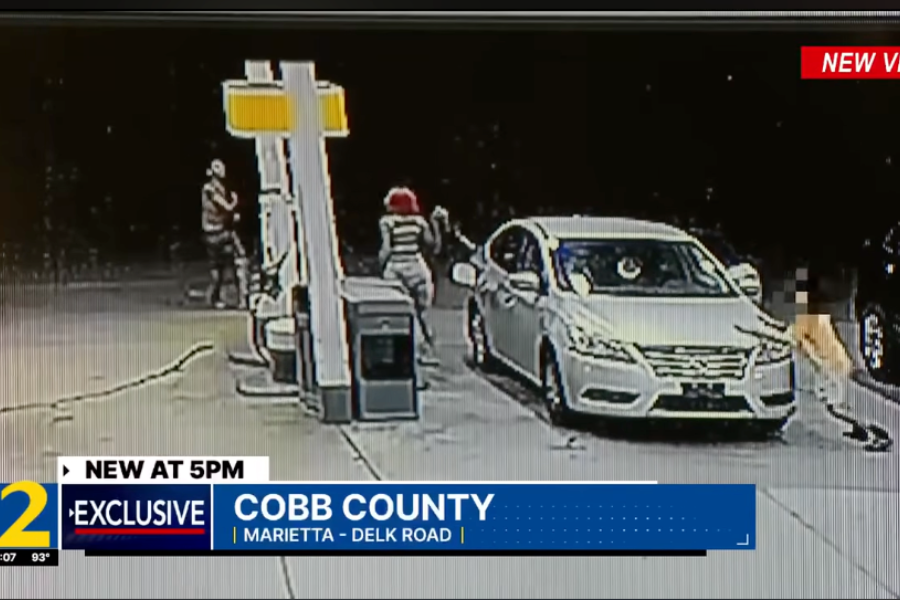 Surveillance video captures the terrifying moment a stranger allegedly tried to kidnap a child as his mother pumped gas at a Shell station in Marietta, Georgia