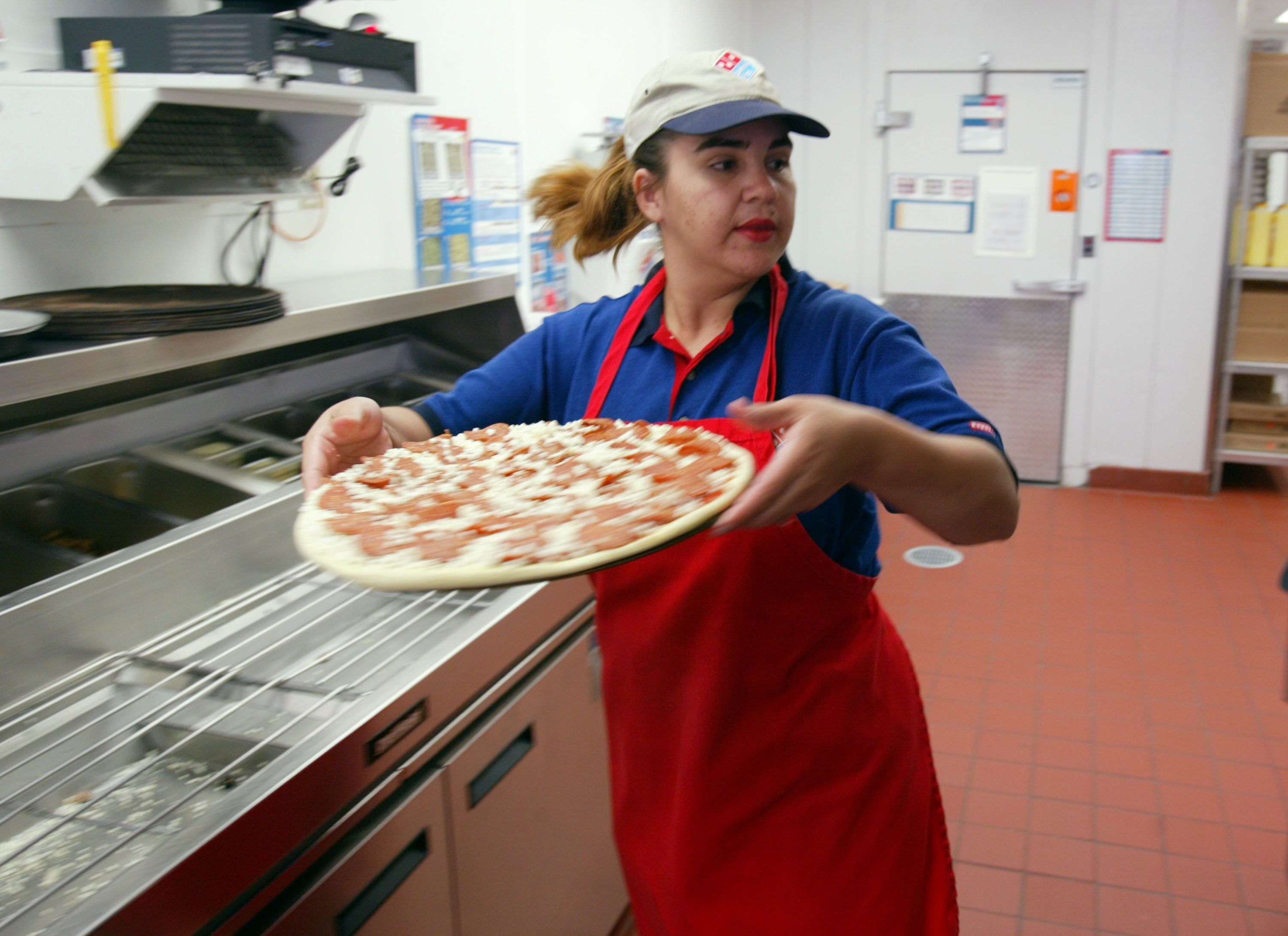 Domino’s led major chains in worker pay with a 291-to-1 CEO-to-employee ratio. The pizza giant reported a median annual compensation of $36,776 for a part-time delivery driver, keeping chief executive Russell Weiner’s $10.7 million pay package significantly closer to front-line earnings (Getty Images)