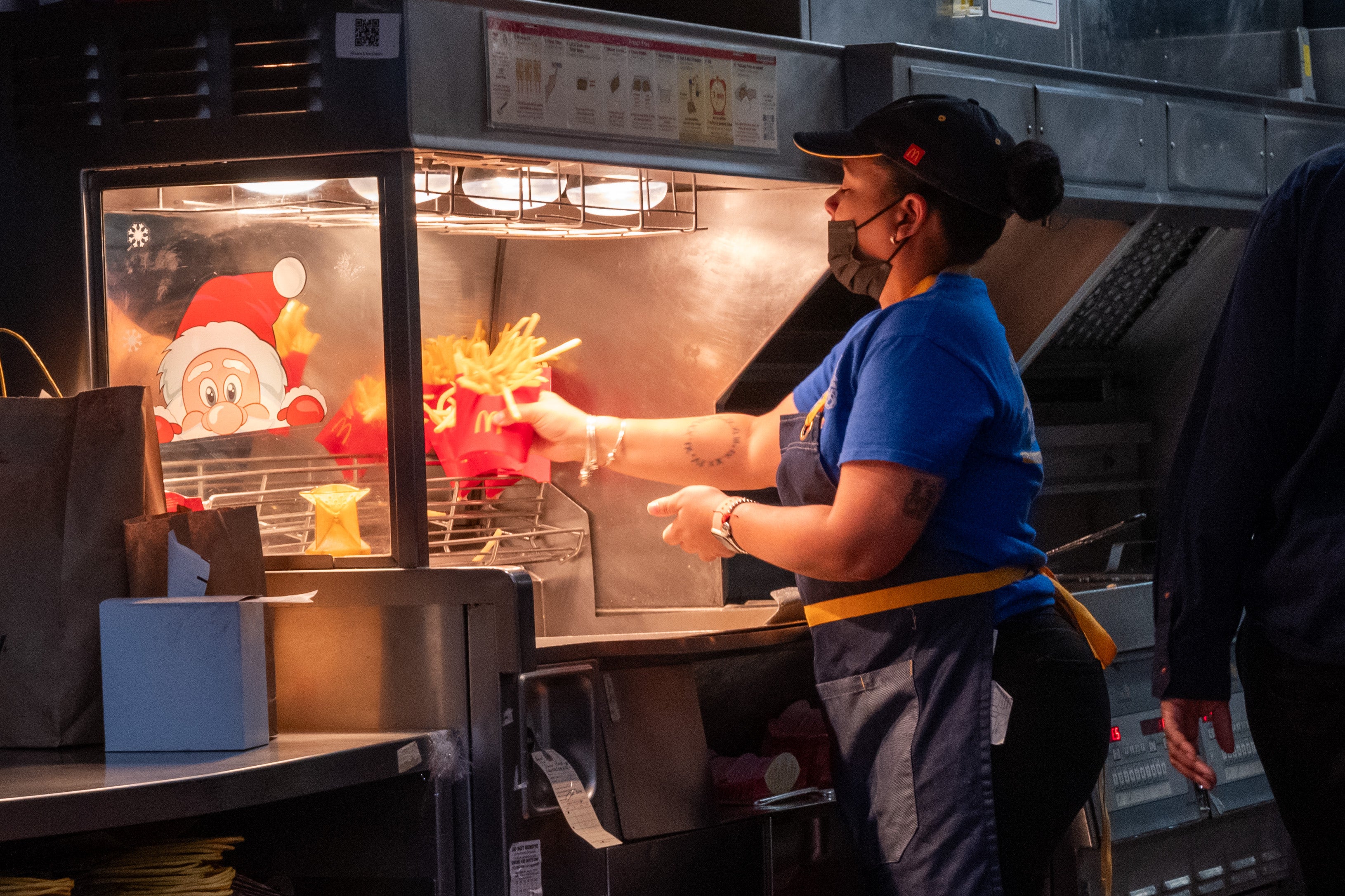 McDonald’s benchmarked its 1,082-to-1 pay ratio using an overseas employee in Poland. While Chief Executive Chris Kempczinski received $20.5 million in 2025, the burger chain selected a crew member earning $19,020 as its baseline (Getty Images)