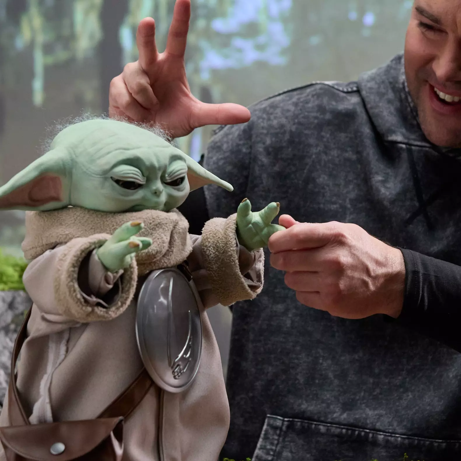 Ultimate Grogu features more than 250 animations, using 14 sensors to respond to touch and movement with lifelike reactions like blinking, ear wiggles and Force-inspired gestures (Hasbro)