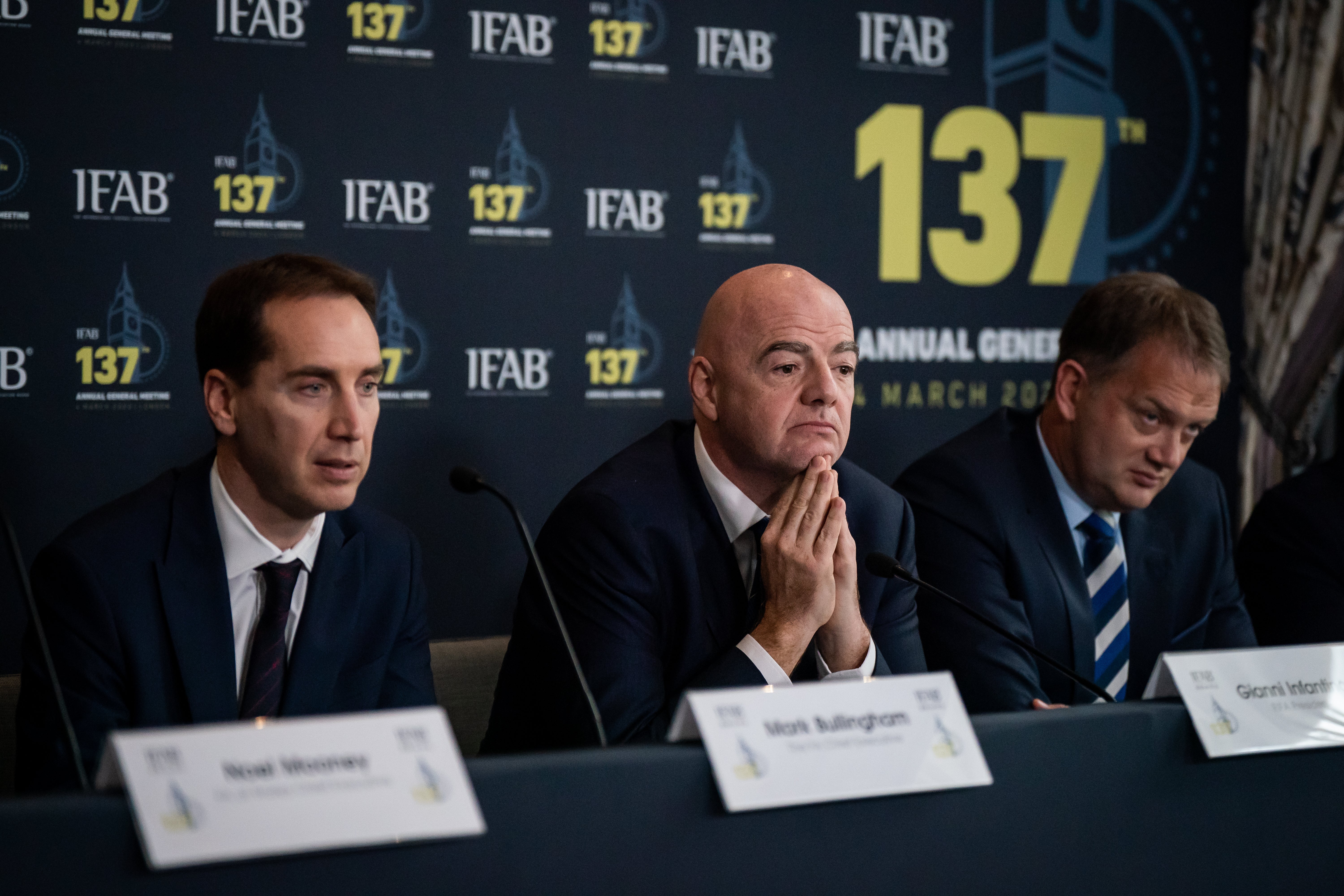 FA chief executive Mark Bullingham (left) next to Infantino (centre) (PA)