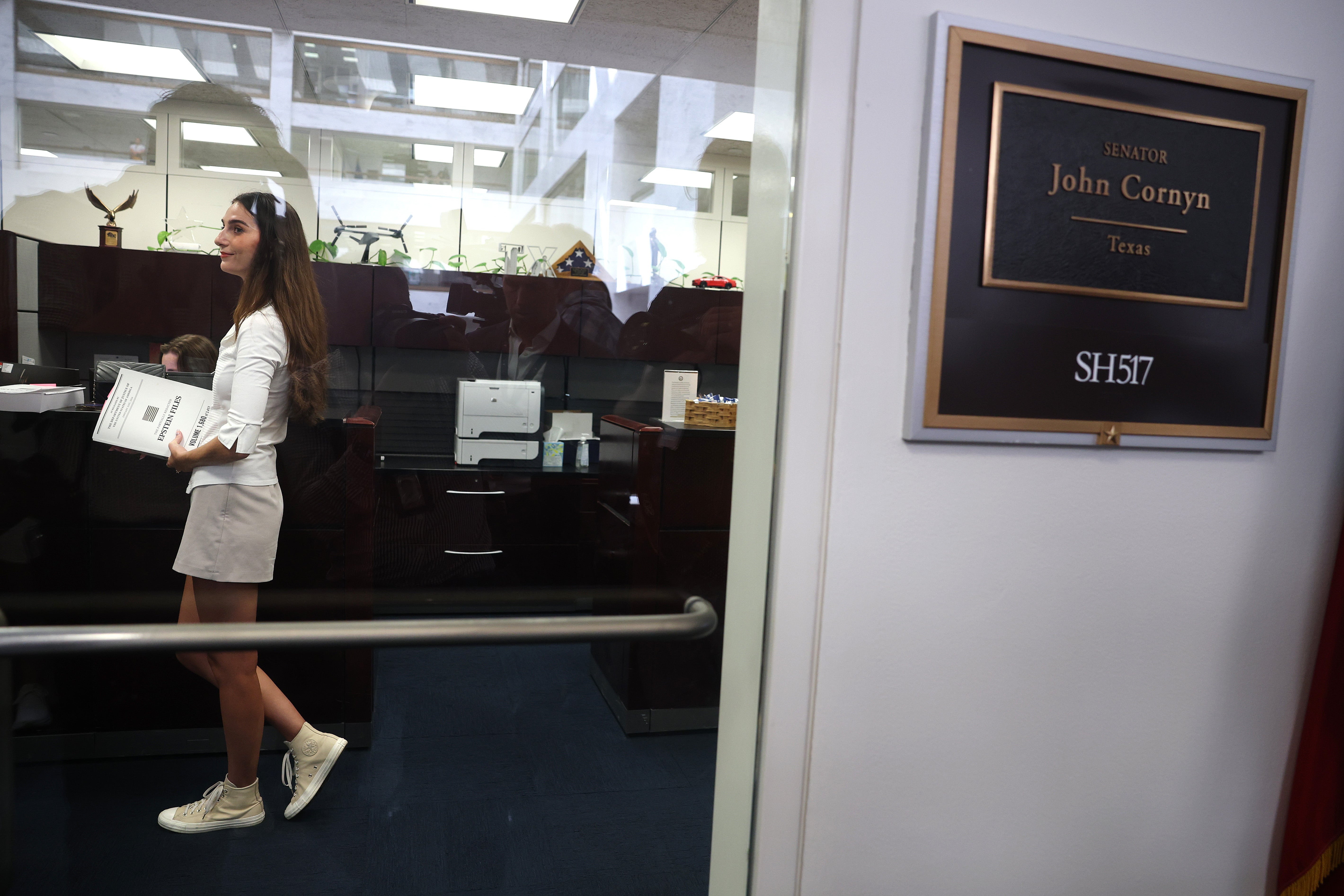 A survivor of Jeffrey Epstein stands inside Sen. John Cornyn's (R-TX) office at the Hart Senate Office Building on Wednesday. The Epstein survivors attempted to meet with Cornyn and Attorney General nominee Todd Blanche over the Department of Justice's handing of the Epstein files.