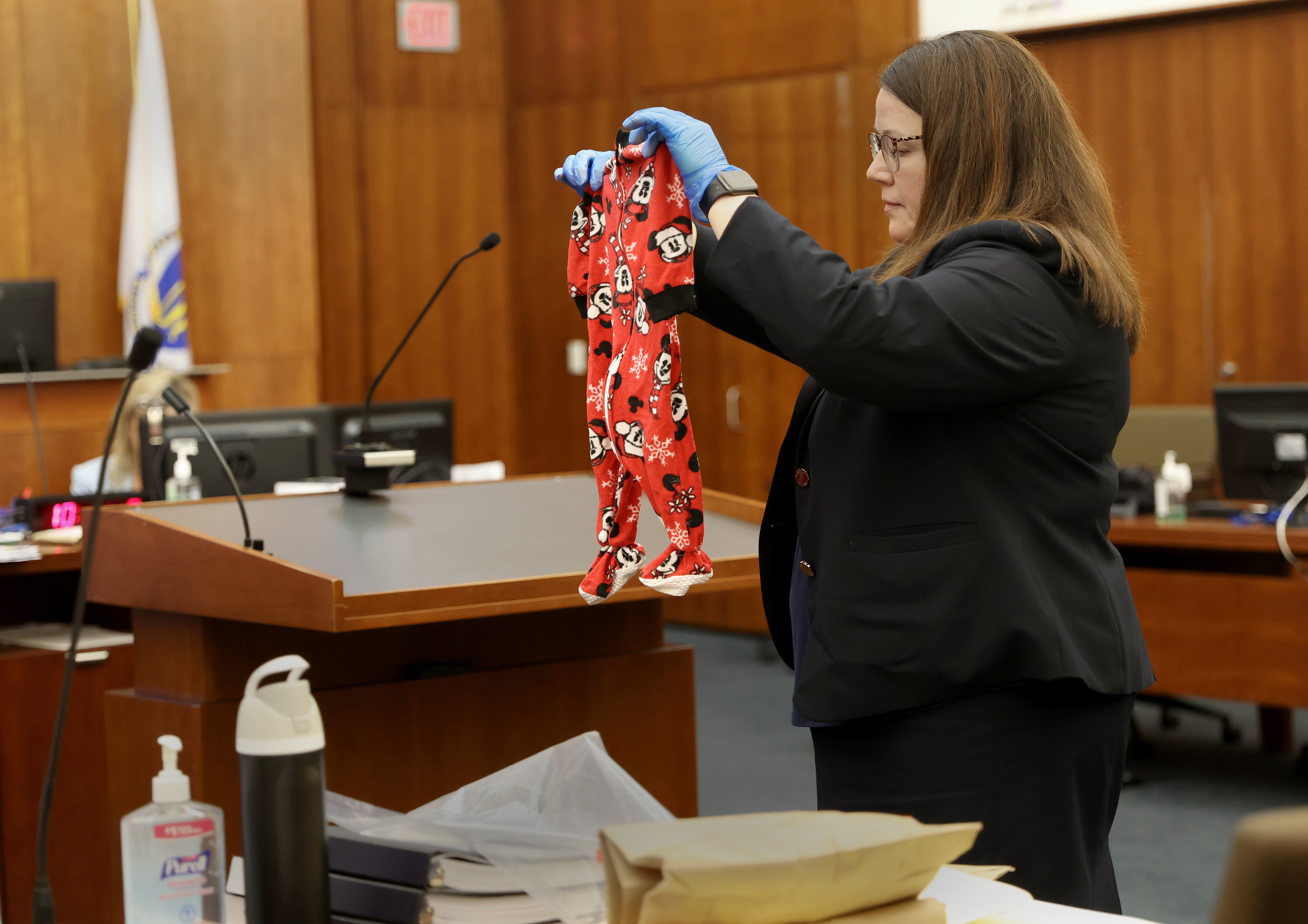 Assistant District Attorney Jennifer Sprague holds up as evidence the pajamas of Callan Clancy (AP)
