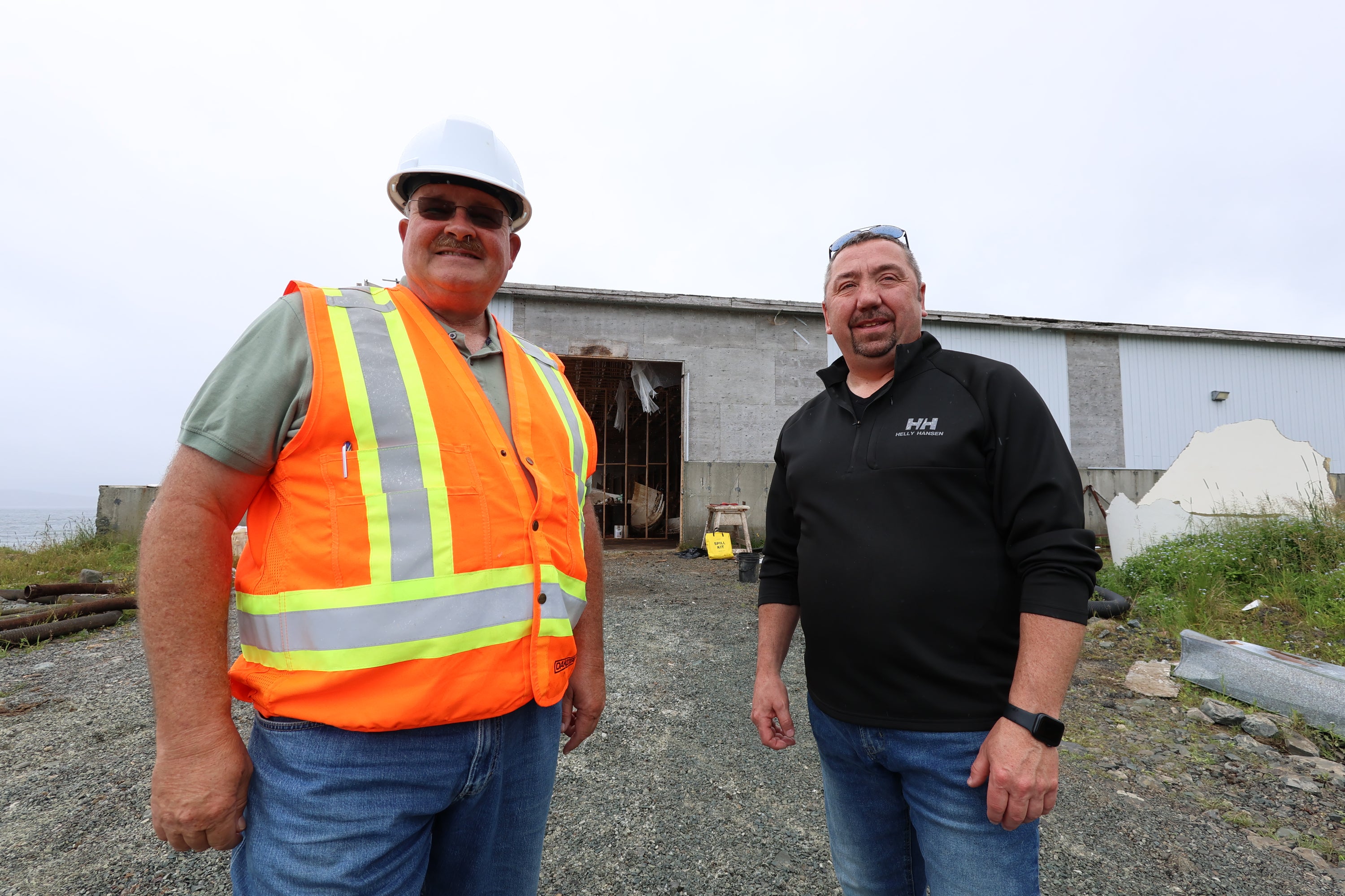 Sharp stands next to Steve Ryan, mayor of St. Mary's, who says the town has spent years trying to give residents some relief