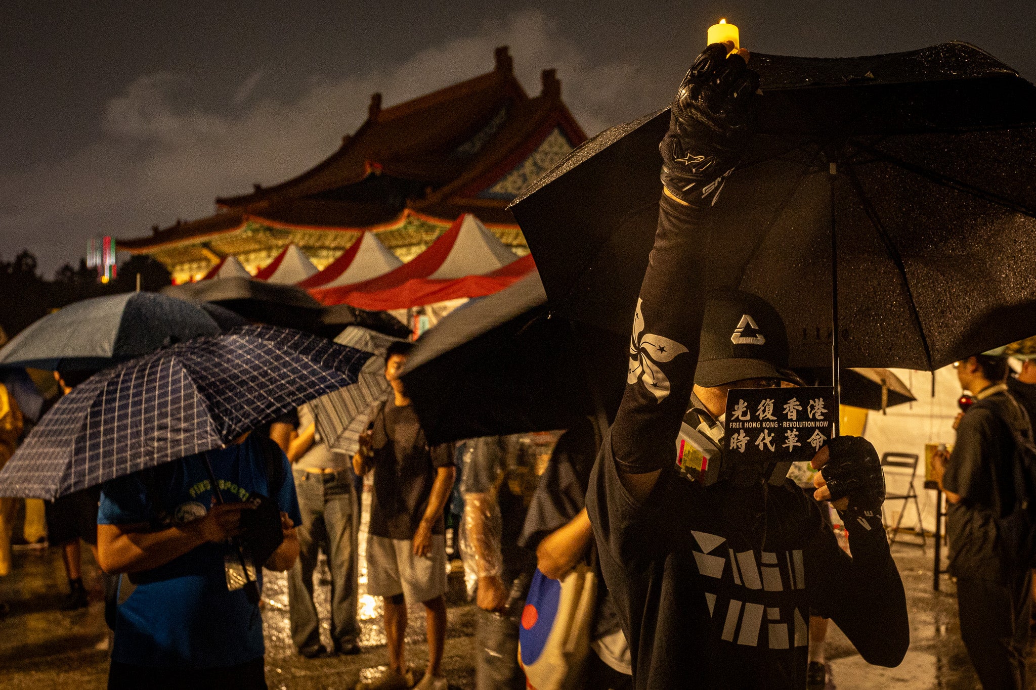 A demonstrator holds an electronic candle during a vigil at Liberty Square in Taipei on 4 June 2026 to commemorate the anniversary of China's 1989 crackdown on pro-democracy protesters in Beijing's Tiananmen Square