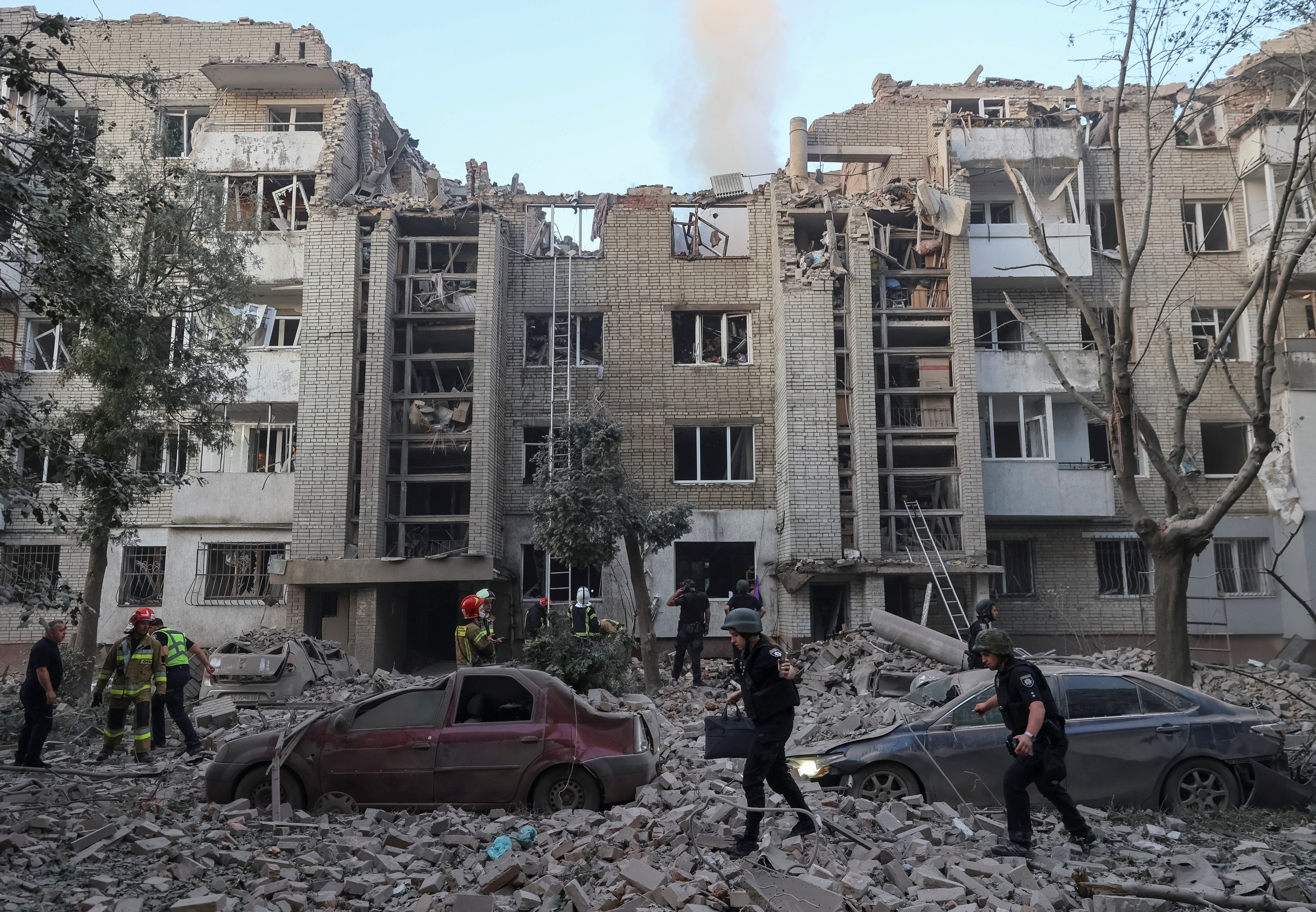 Rescuers work at the site of an apartment building hit by a Russian missile strike, amid Russia's attack on Ukraine, in Lviv, Ukraine