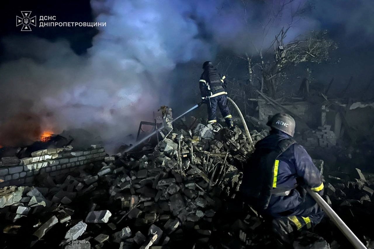 Emergency personnel at work following Russian missile strikes in Ukraine on Thursday