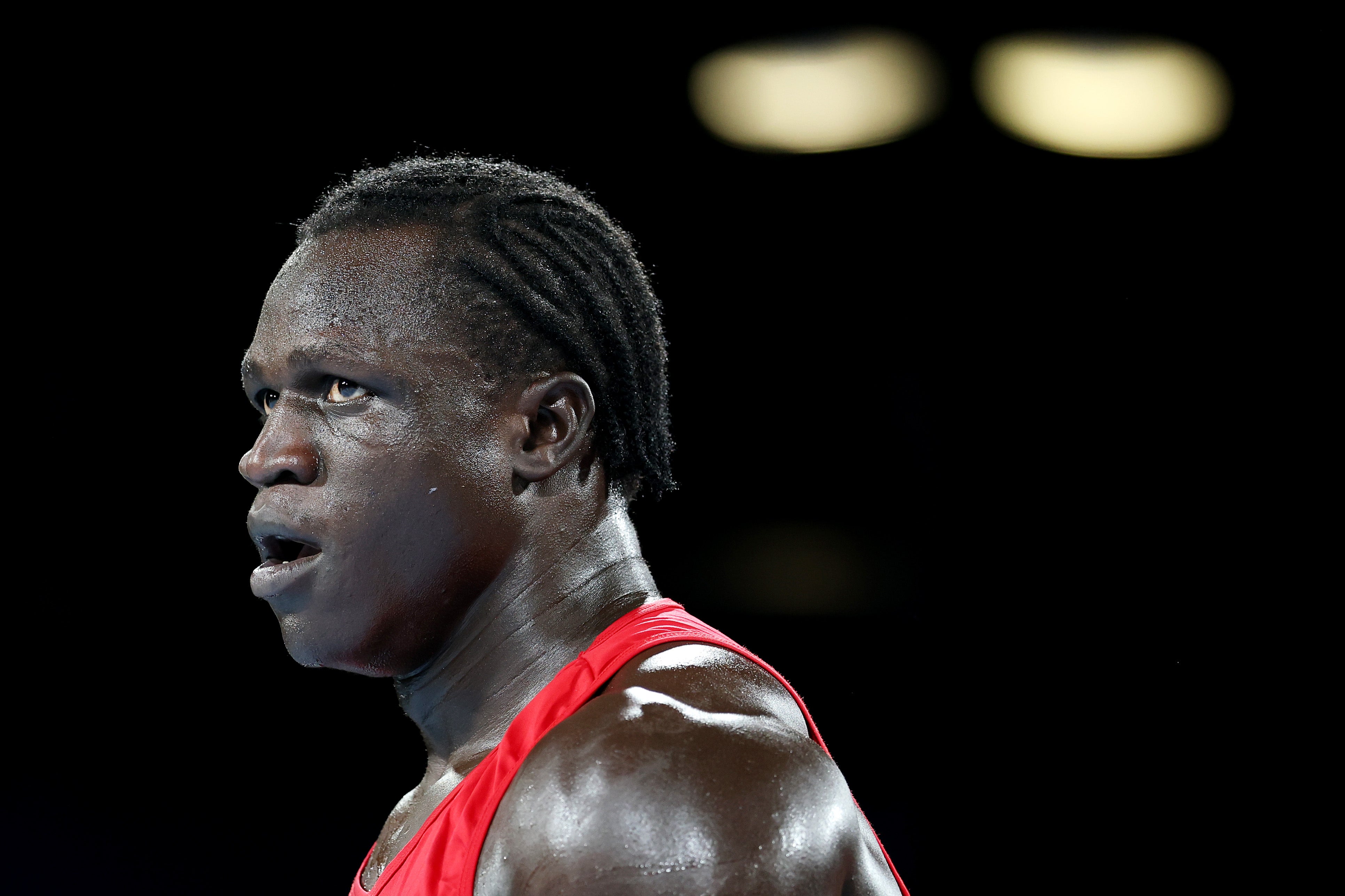 Aziz Abdul of Team Uganda looks on against Damar Thomas of Team England
