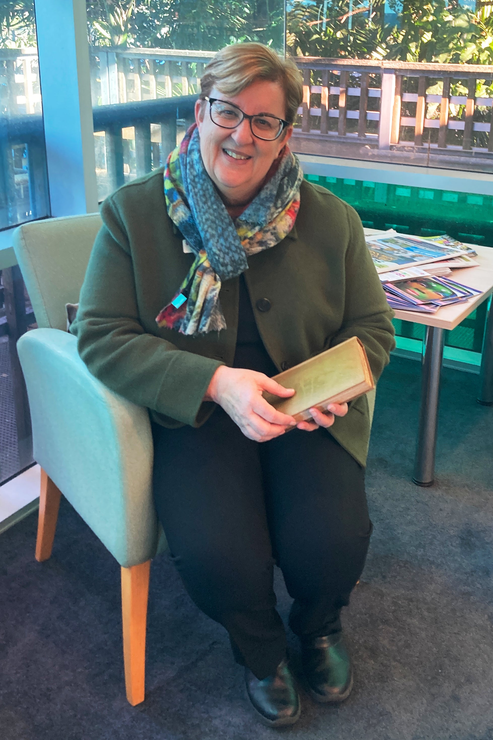 Library manager Michelle Hudson holds the book after its return