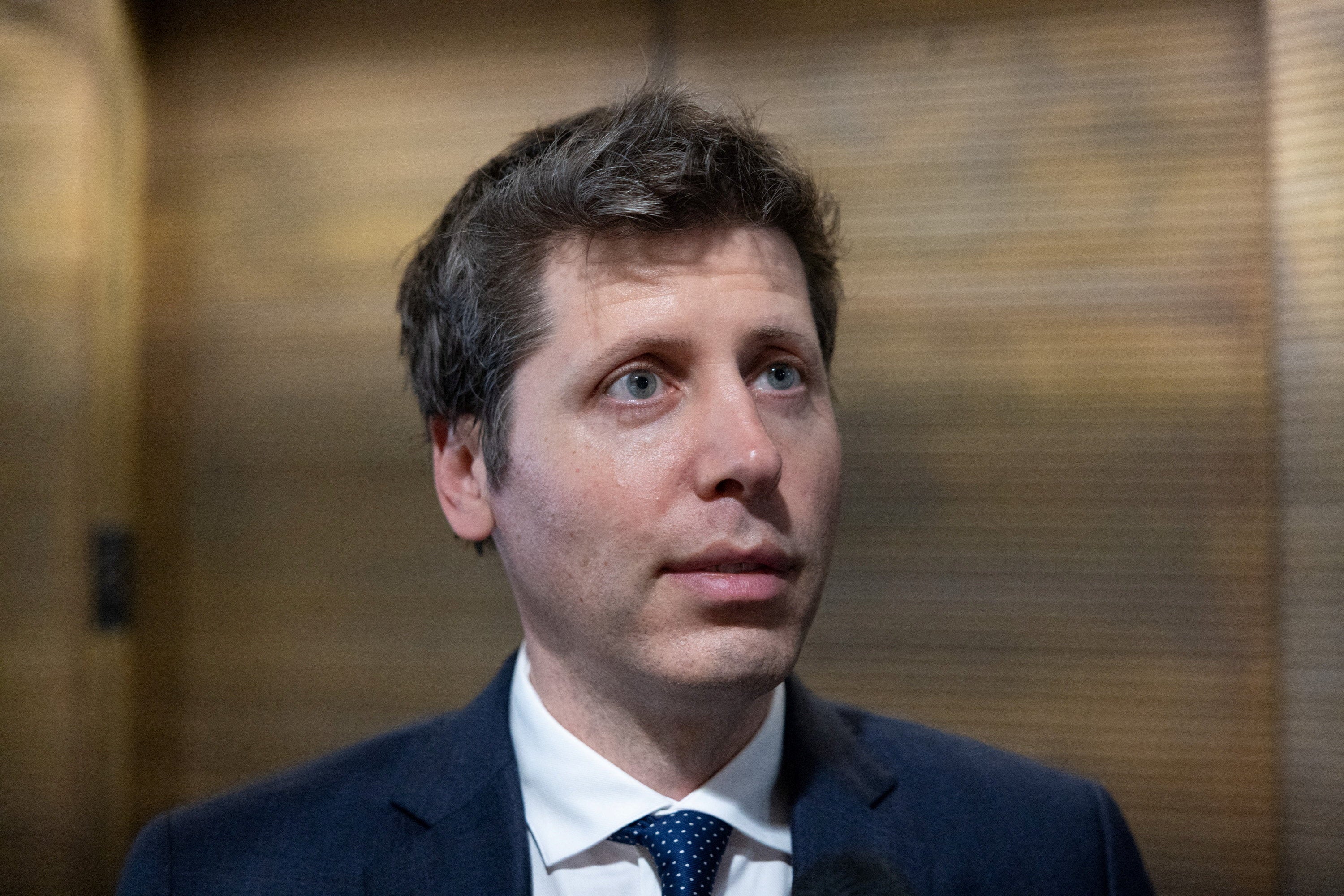 OpenAI CEO Sam Altman speaks to a reporter in the Hart Senate Office Building on Capitol Hill this week