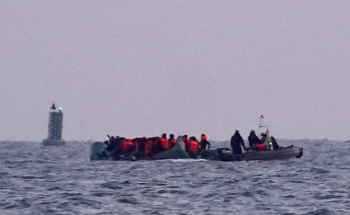 People head out to sea on board a small boat after leaving the beach near Dunkirk in France on Thursday (Gareth Fuller/PA) (PA Wire)