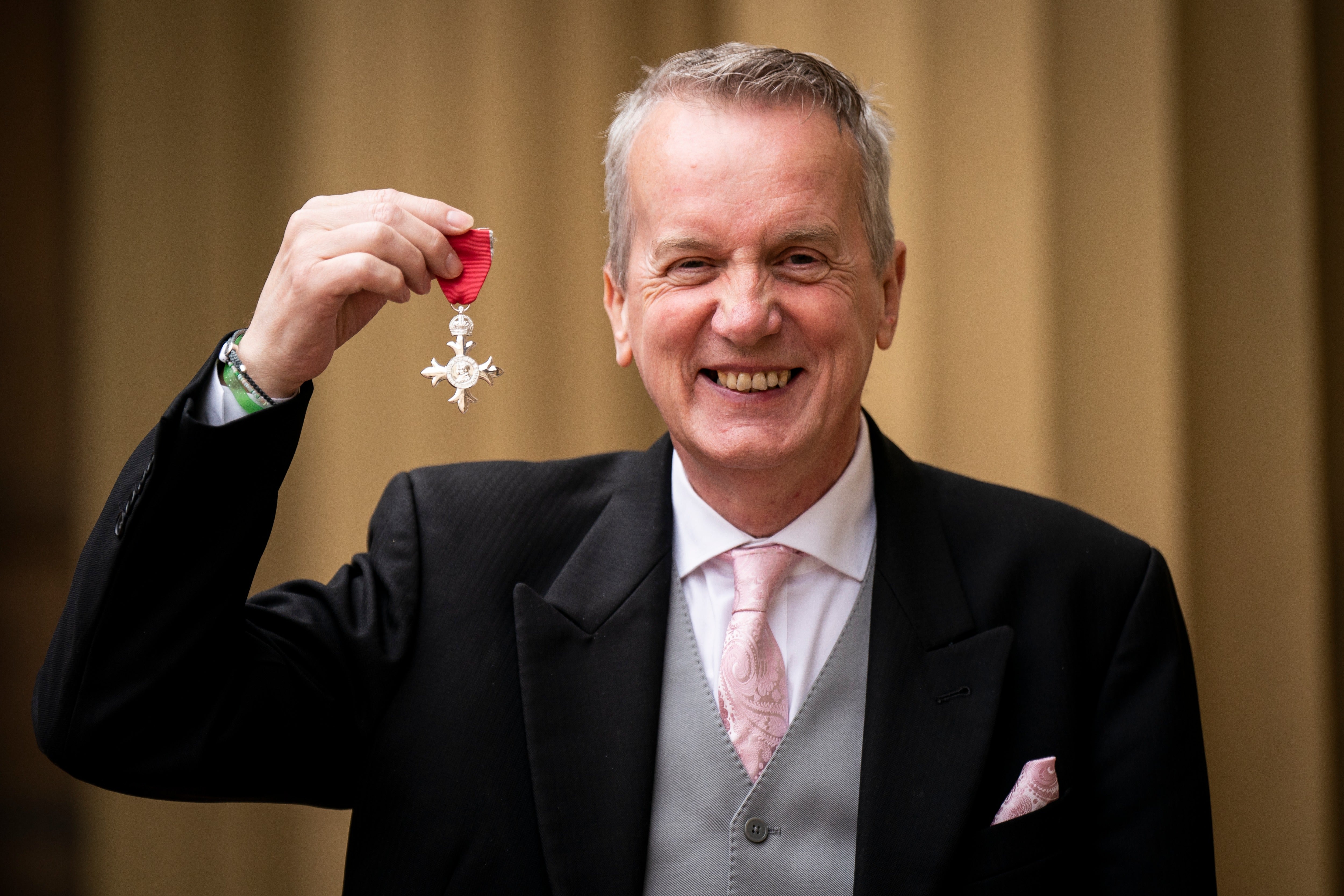 The New New Lad: Skinner poses after accepting an MBE for services to entertainment in 2023
