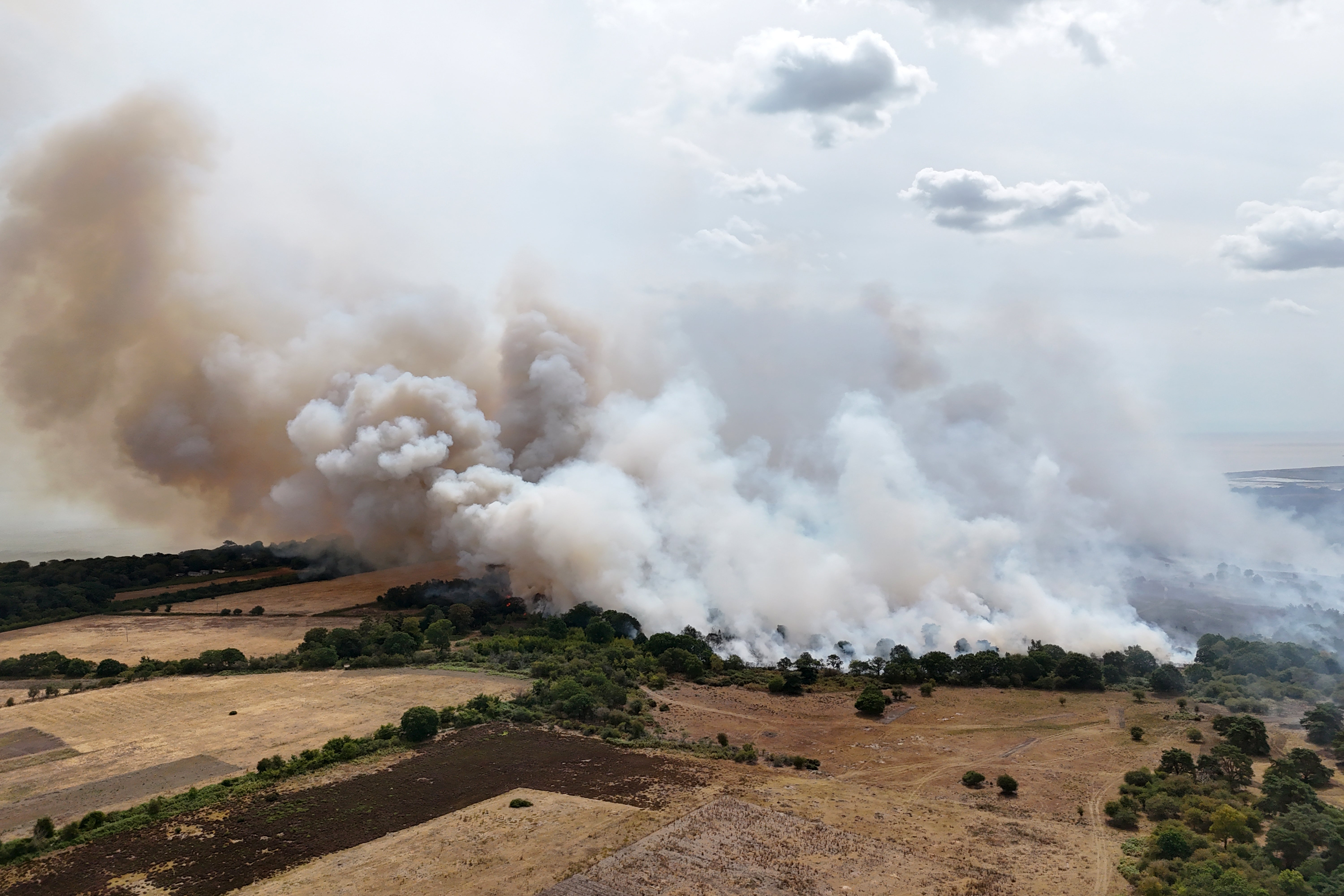Smoke rises from the wildfire at Dunwich Heath (Suffolk County Council/PA) (PA Wire)
