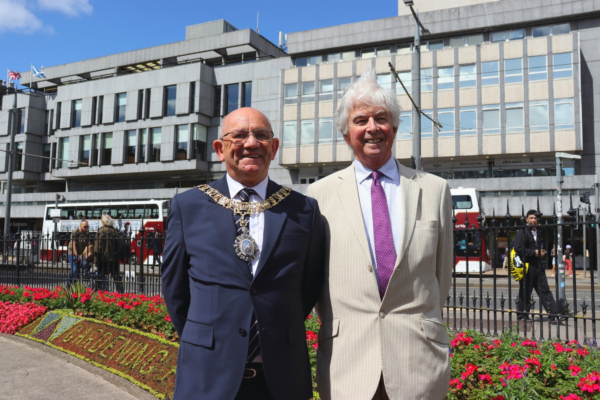 The Lord Provost of the City of Edinburgh, Robert Aldridge, with Sir Andrew Cubie, chair of the Trellis charity, which has been celebrated by the city’s annual floral clock display (Danyel VanReenen/PA)