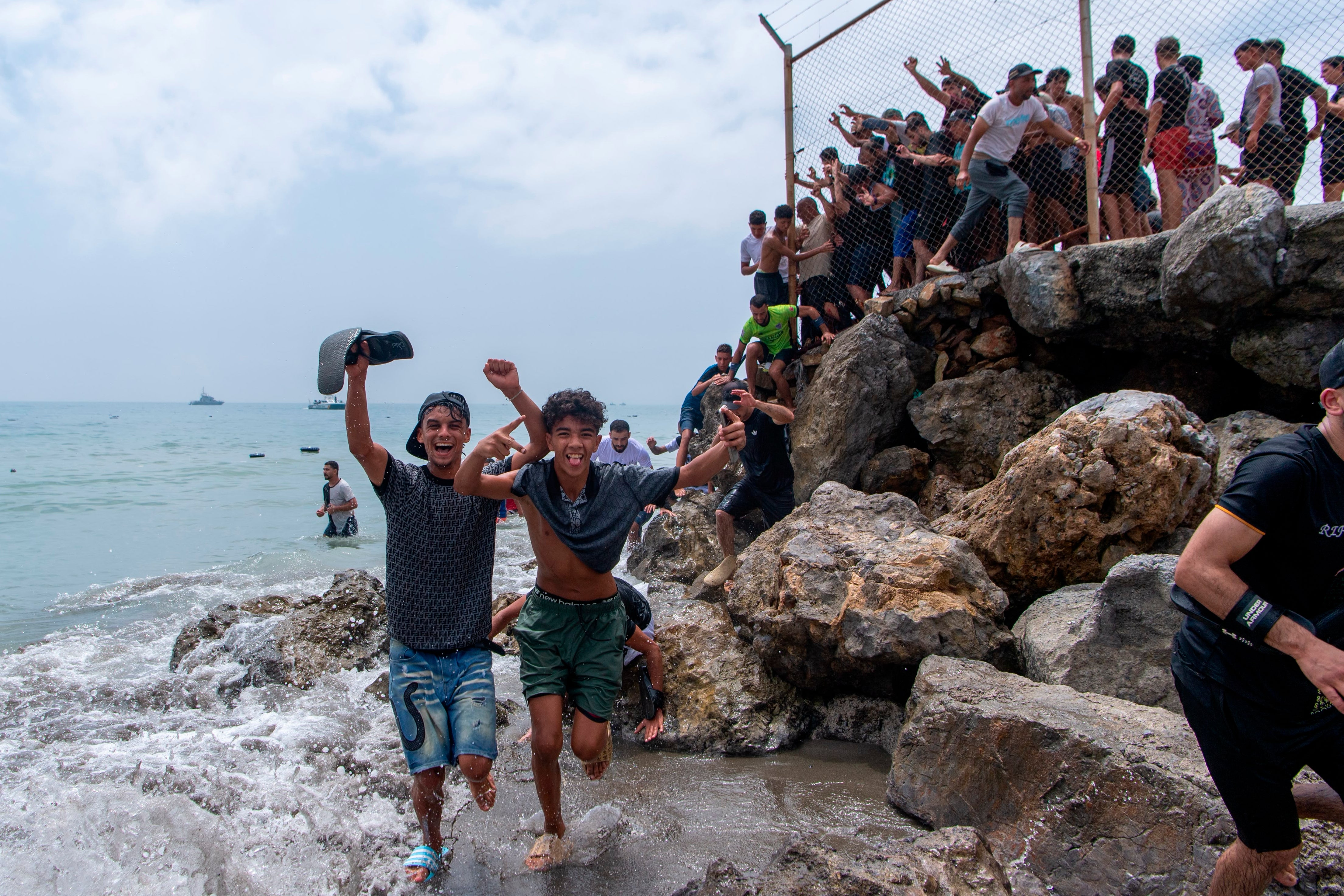 Footage showed crowds of people walking around the breakwaters at Tarajal beach