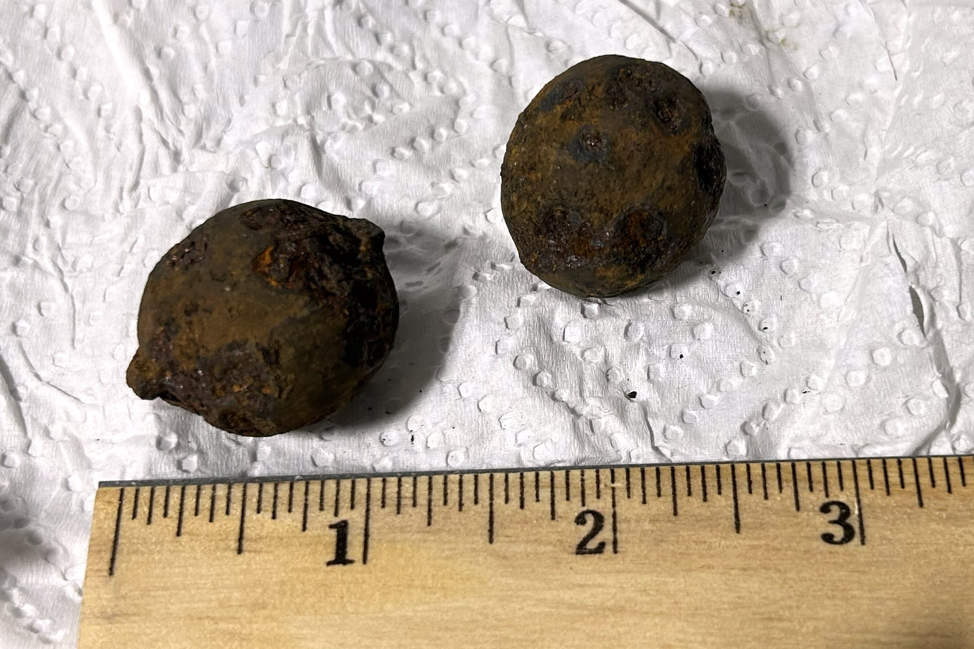 This photo provided by the Transportation Security Administration (TSA) shows two stolen Civil War-era cannonballs discovered by TSA officers in a checked bag at the Gulf Shores International Airport