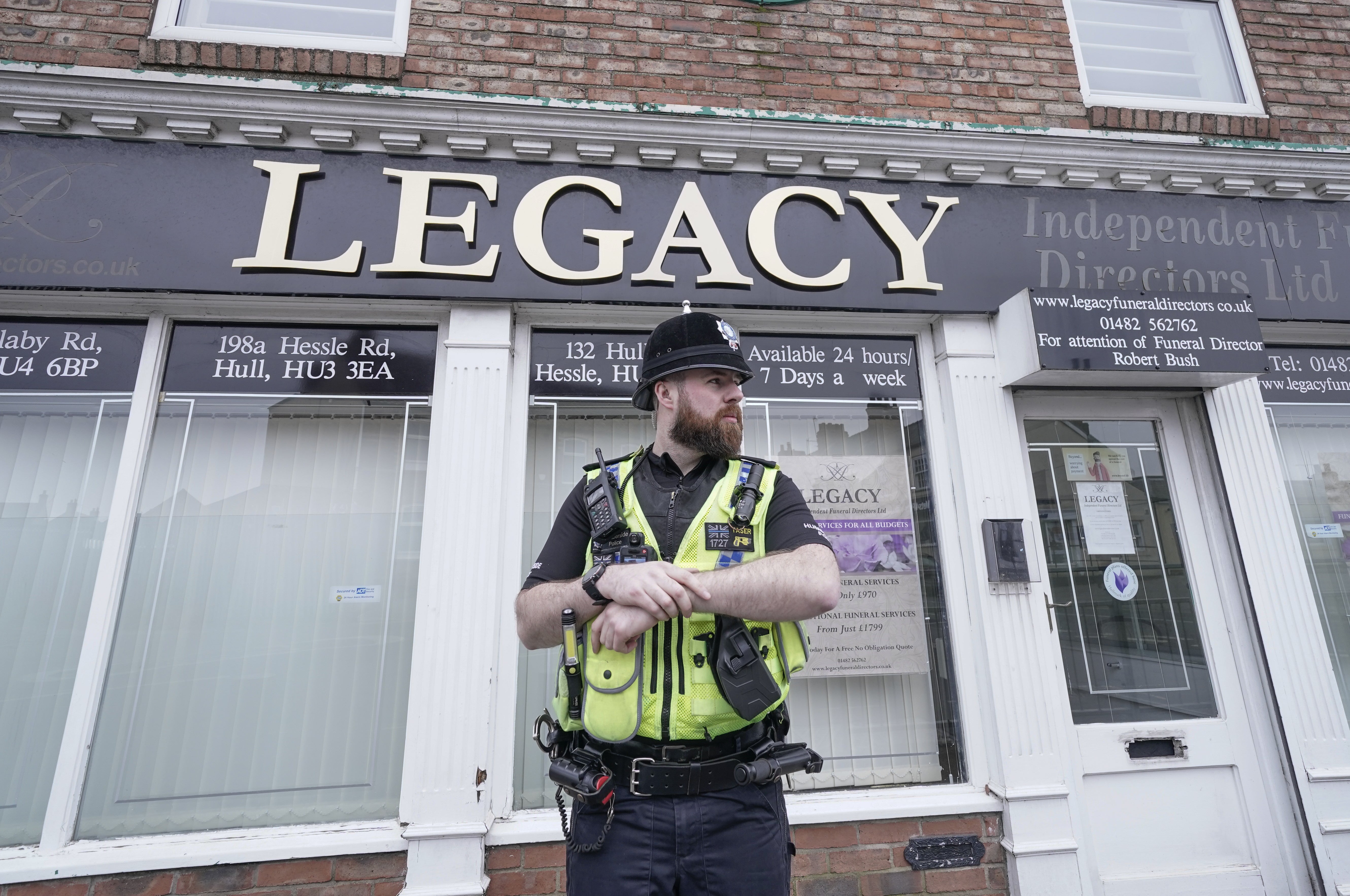 Police outside a branch of Legacy Independent Funeral Directors in Hull in 2024