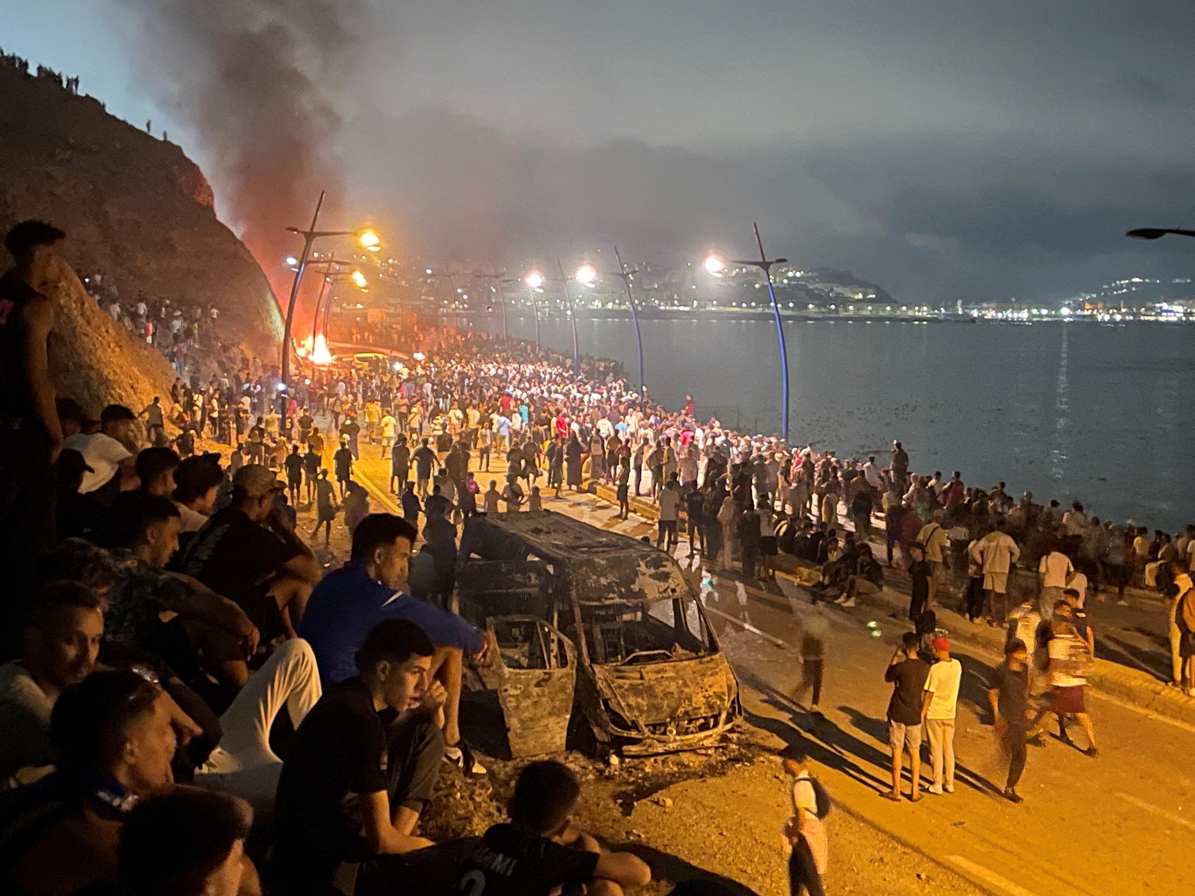 Ceuta: Chaos at Spain border as vehicles torched and thousands of migrants rush from Morocco