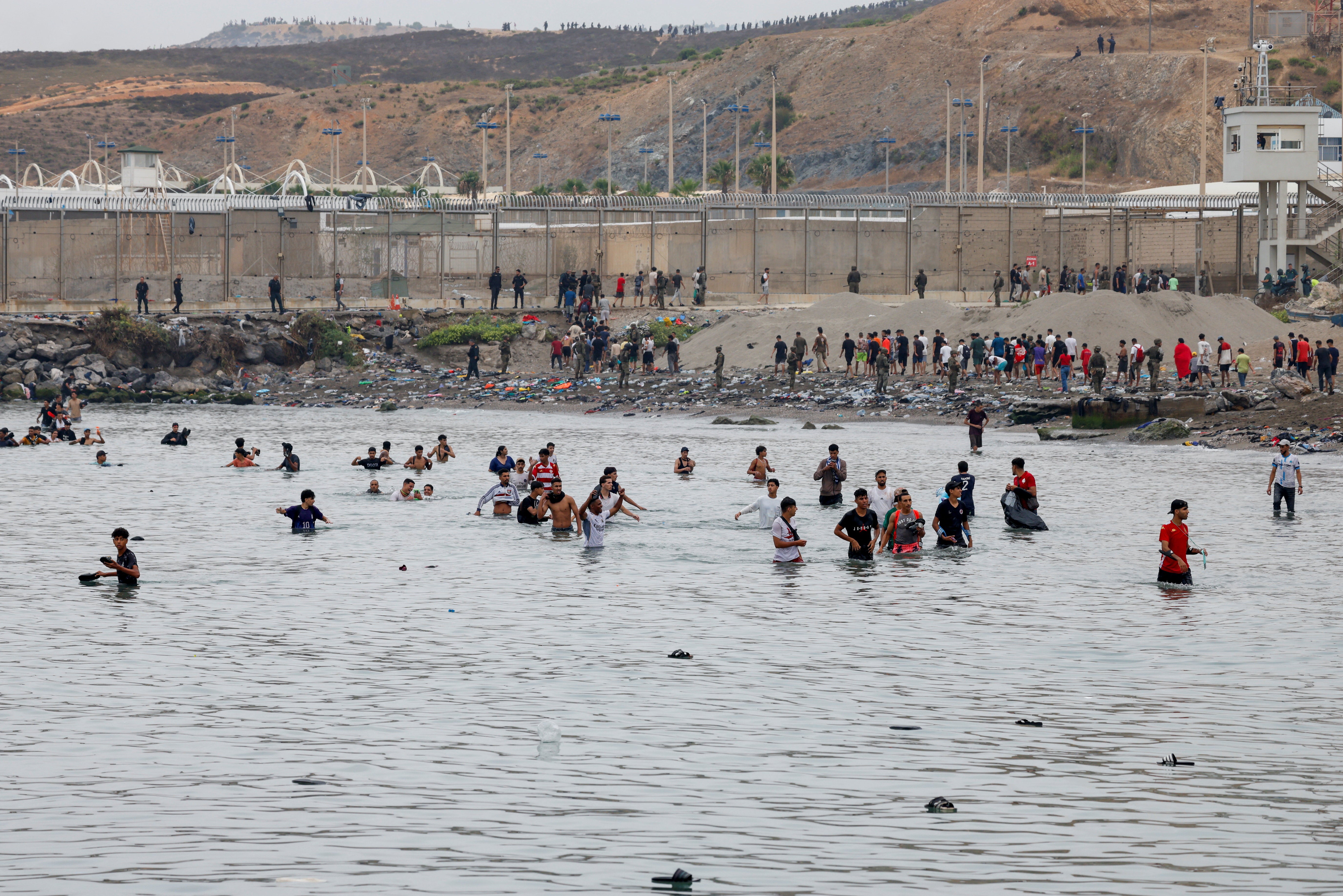 Migrants crossed through water to enter the Spanish territory