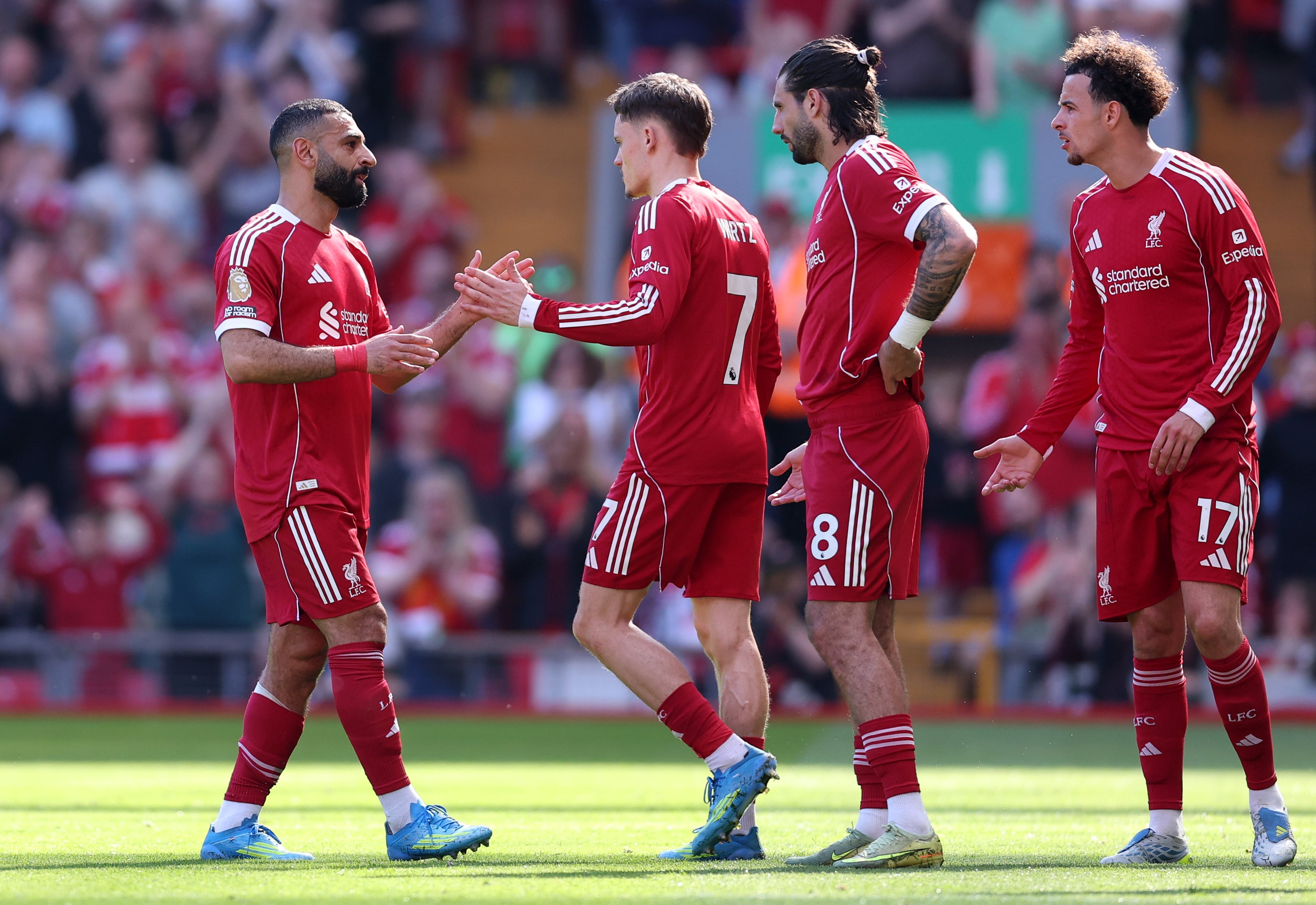 Dominik Szoboszlai (second-right) and Curtis Jones (right) pictured in April