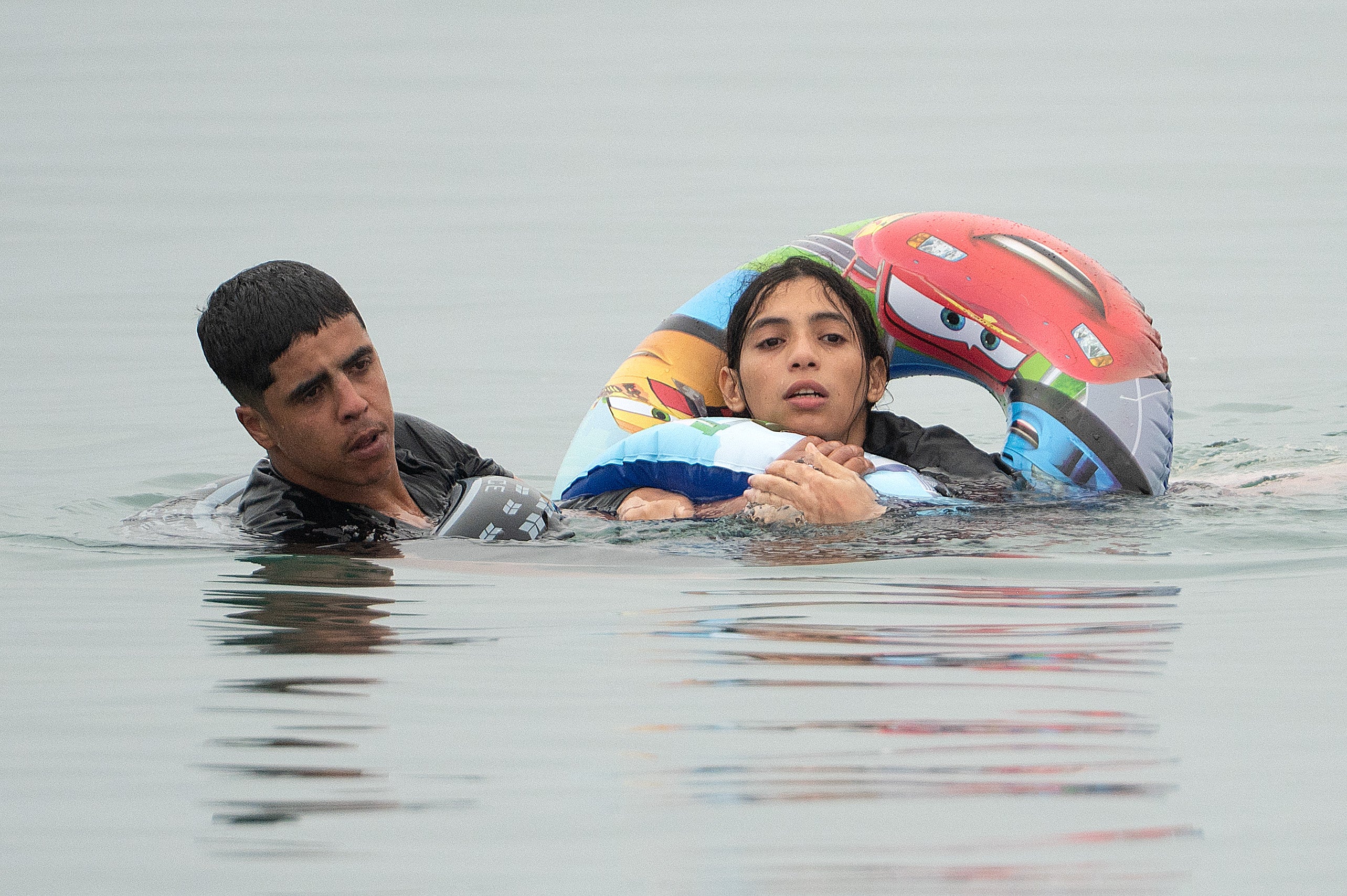 Migrants swim around a border barrier with Morocco to enter Spain's north Africa's Ceuta enclave on July 31, 2026 (Photo by JORGE GUERRERO / AFP via Getty Images) (AFP/Getty)
