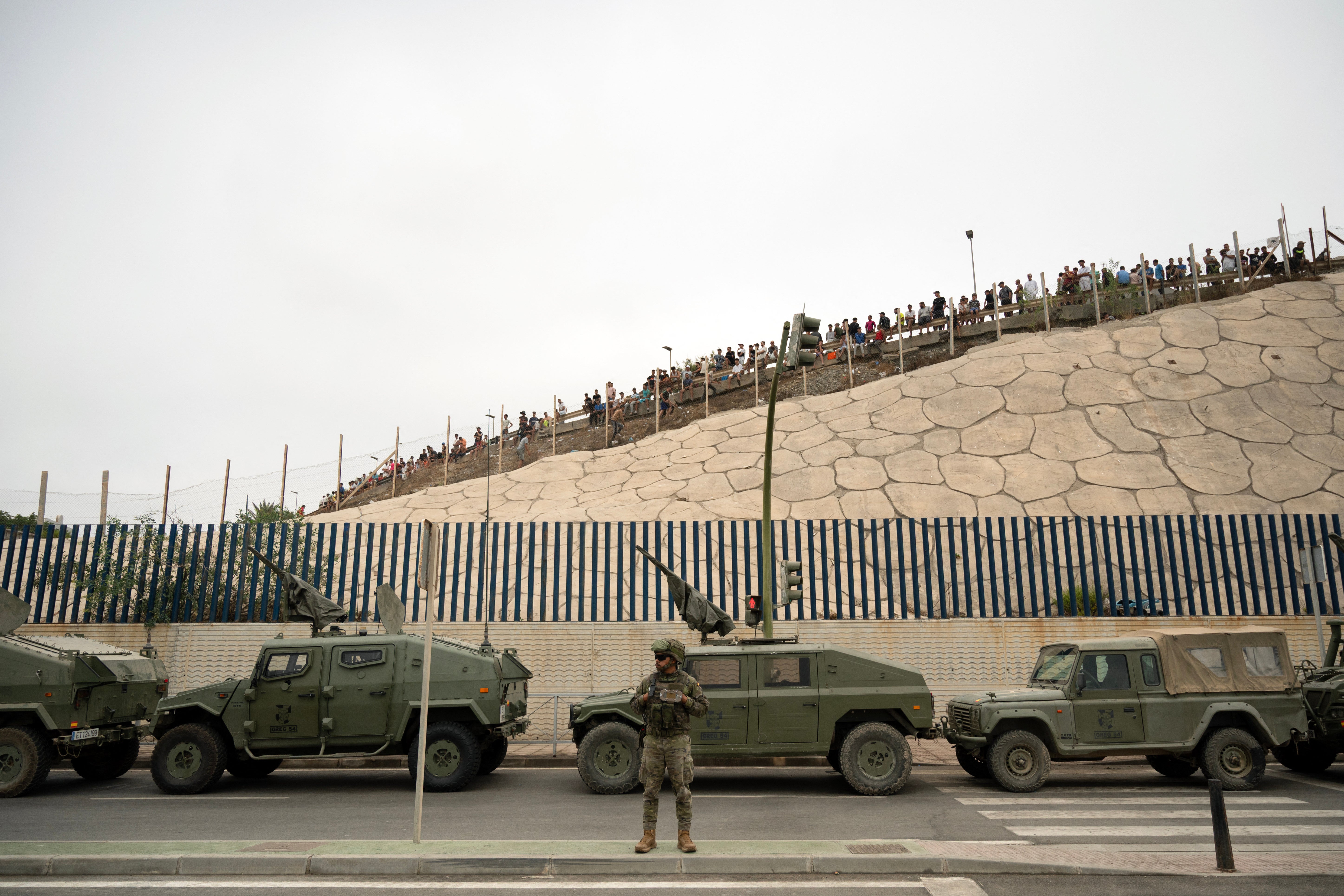 The military has been drawn out to help police the border after thousands of people crossed by land and sea on Thursday