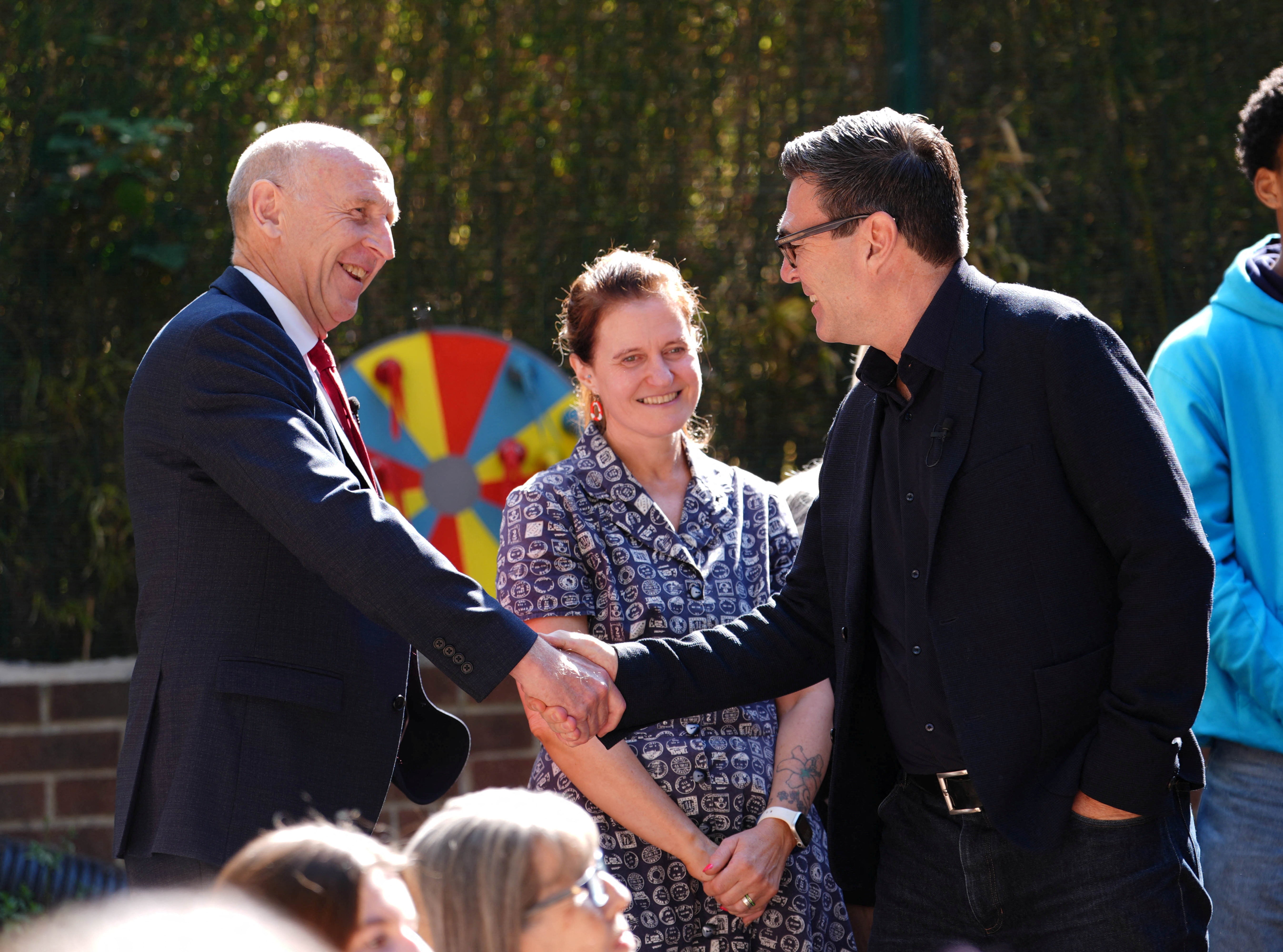 Andy Burnham and John Healey, during a visit to a family centre in Sheffield, South Yorkshire (Reuters)