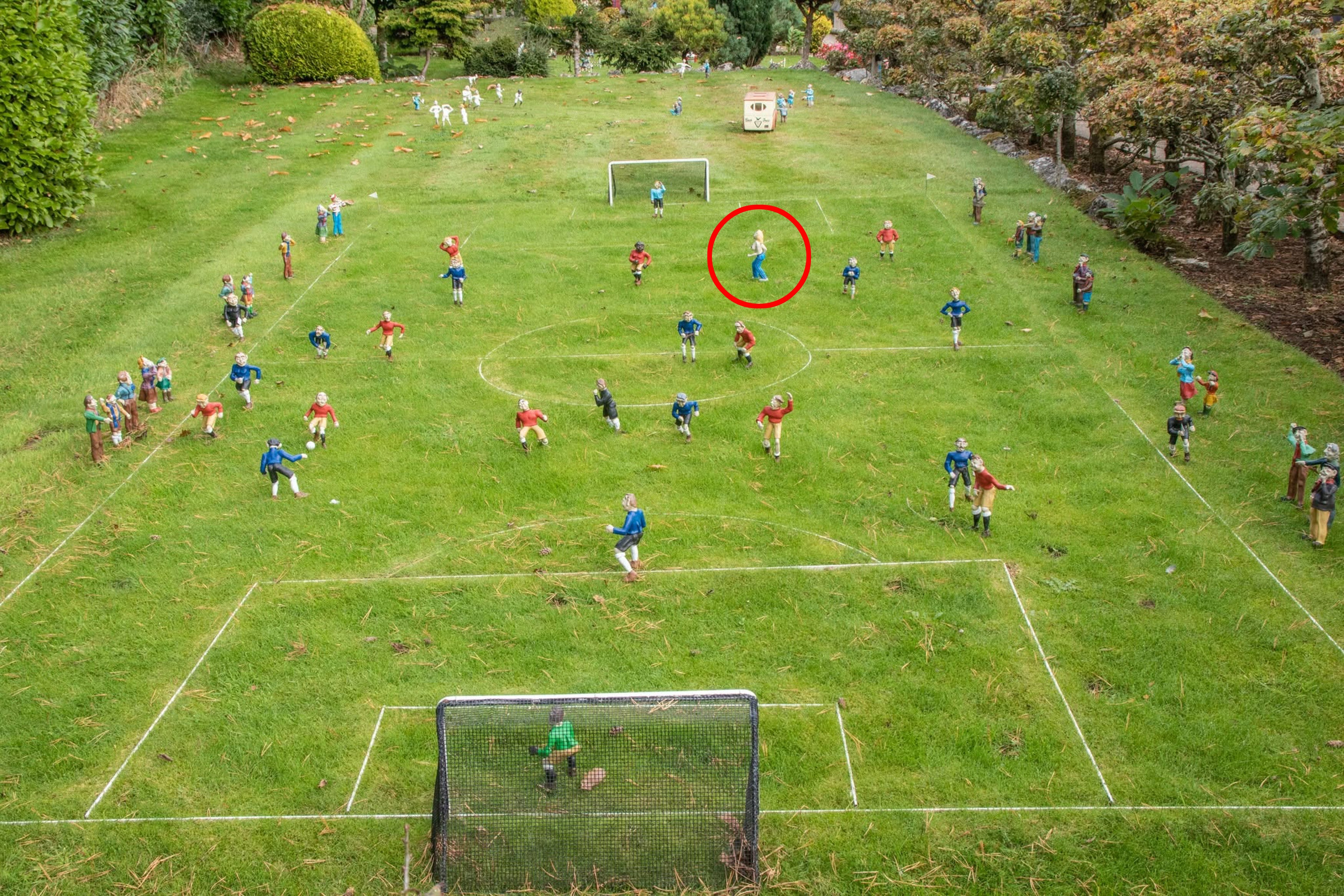 The streaker, circled in red, on the model village’s football pitch