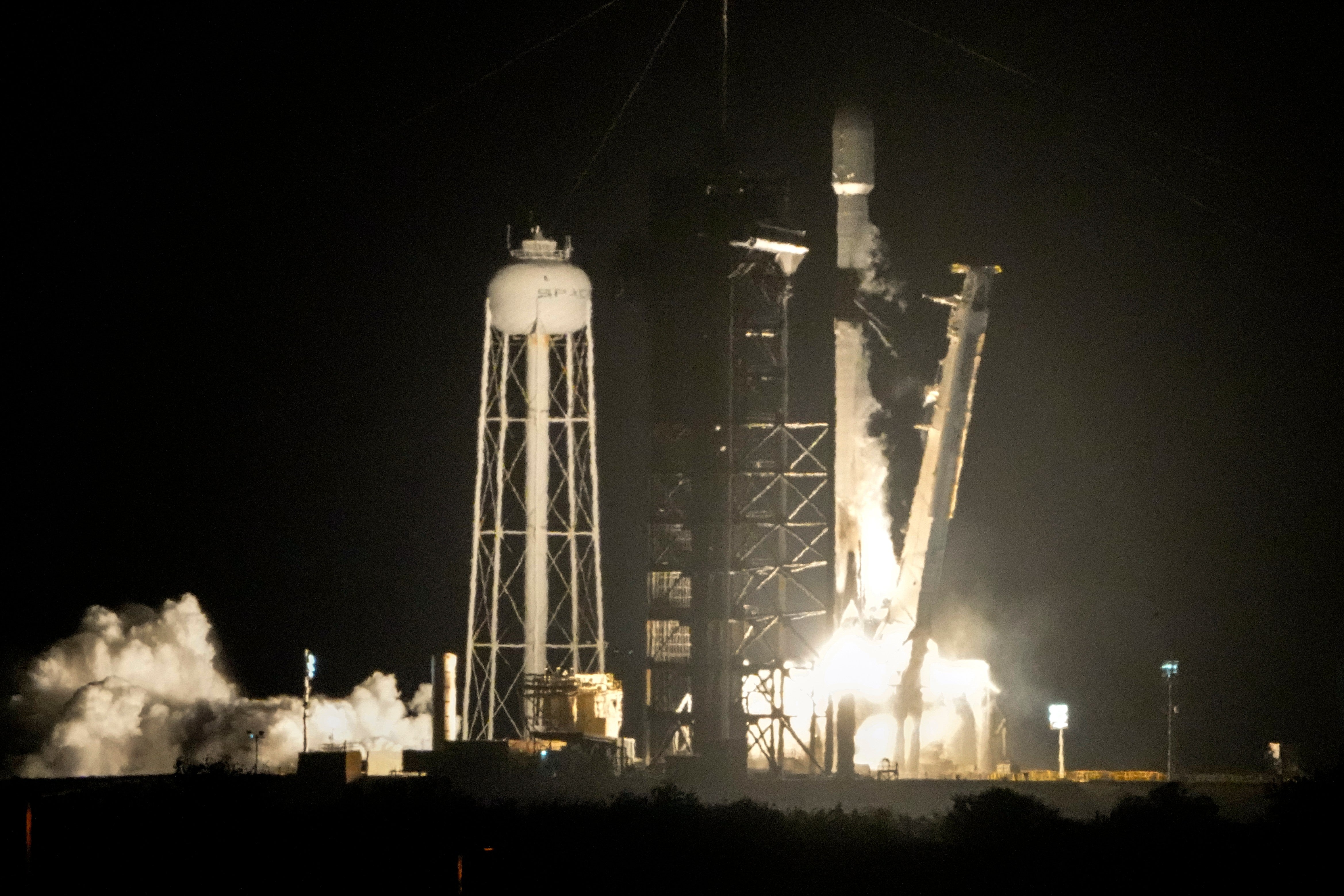 A SpaceX Falcon 9 rocket lifts off from pad 39A with a payload of a pair of lunar landers at the Kennedy Space Center in Cape Canaveral, Fla., Jan. 15, 2025 (AP Photo/John Raoux)