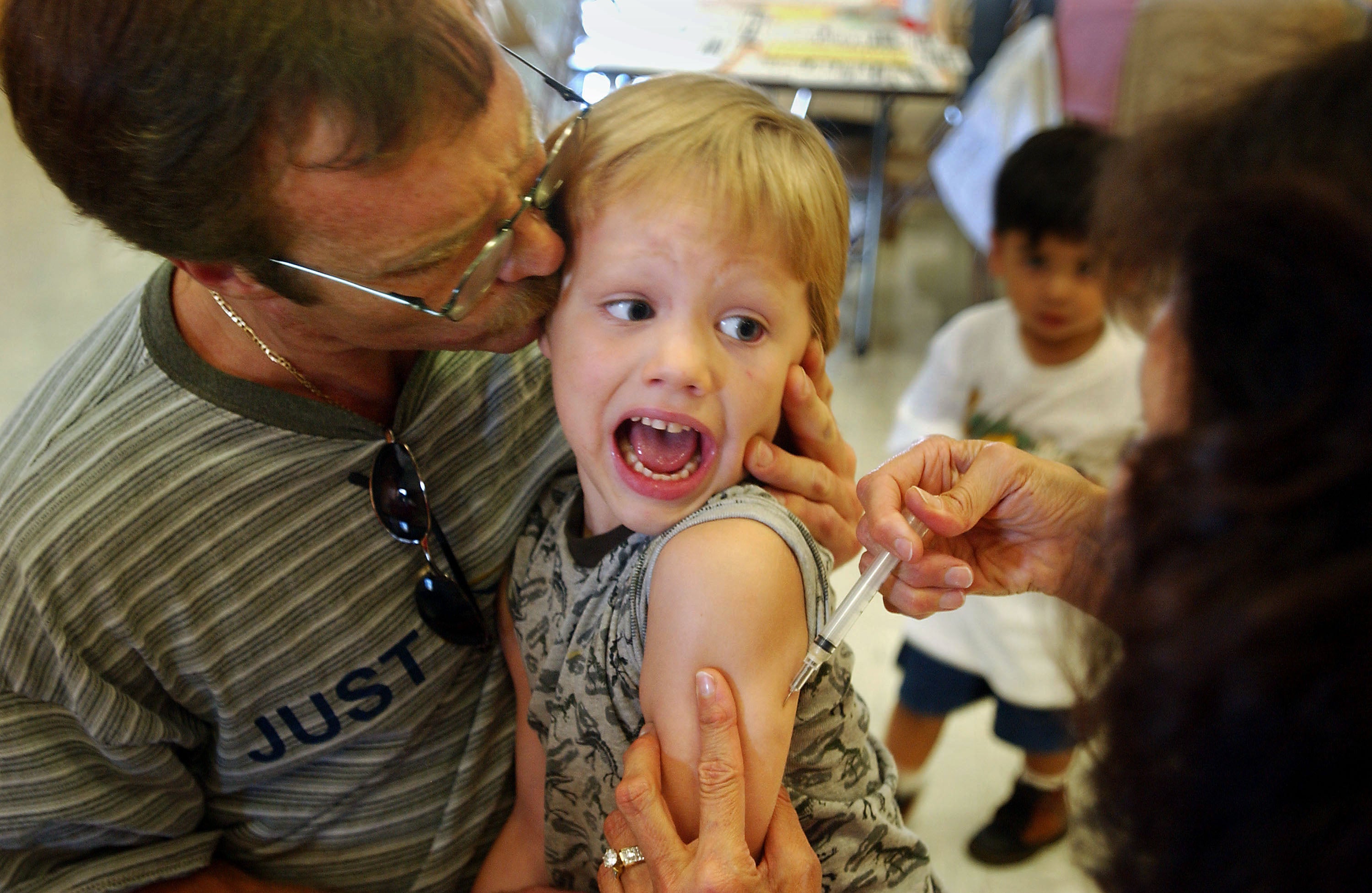 Incoming kindergartener Jeremy Conner, 5, reacts to a measles shot in Santa Ana, California, in August 2002. Measles was declared eliminated in the US in 2000 (Getty)