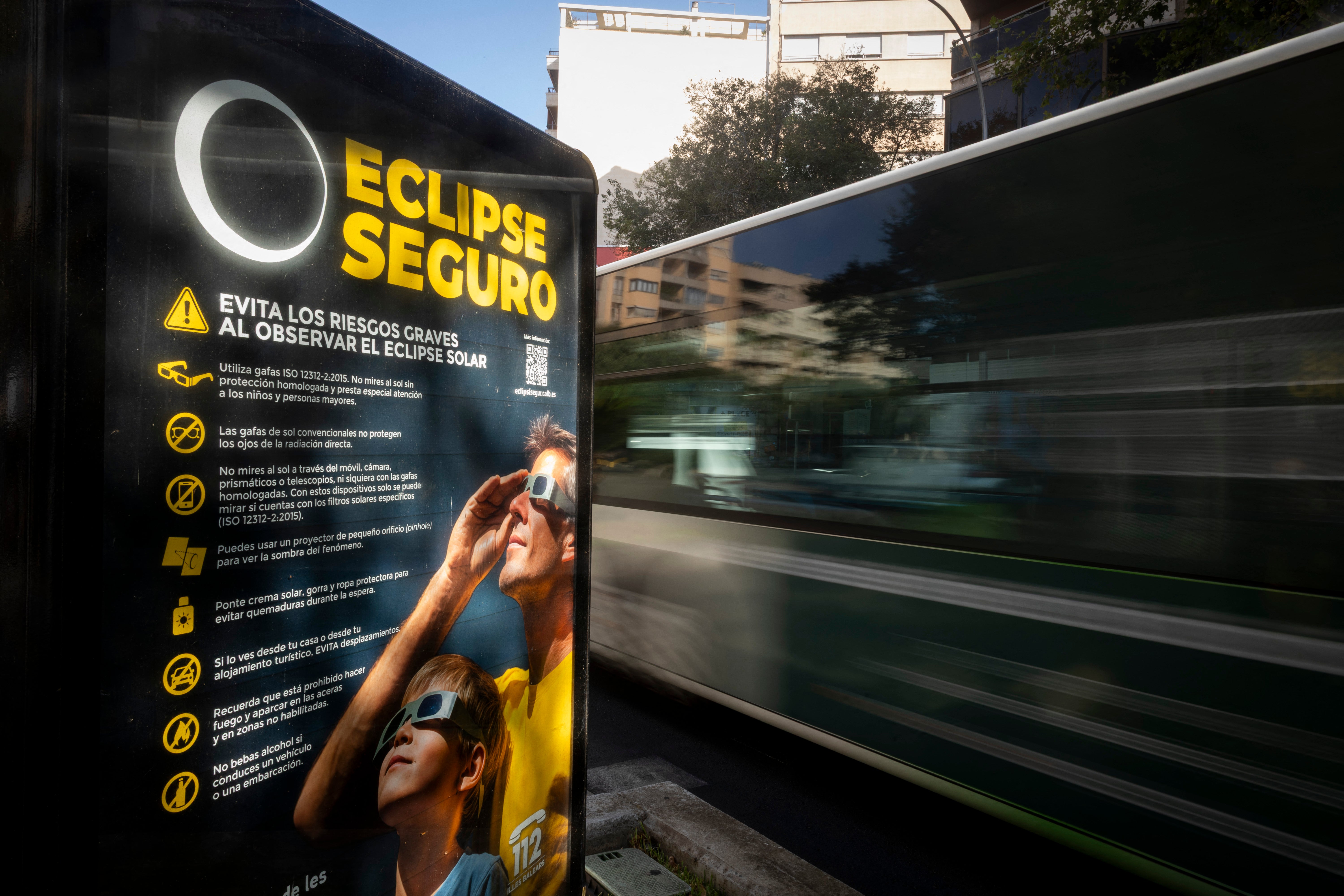 An information panel displays measures on how to safely view an upcoming solar eclipse on a street in Palma de Mallorca on July 31, 2026