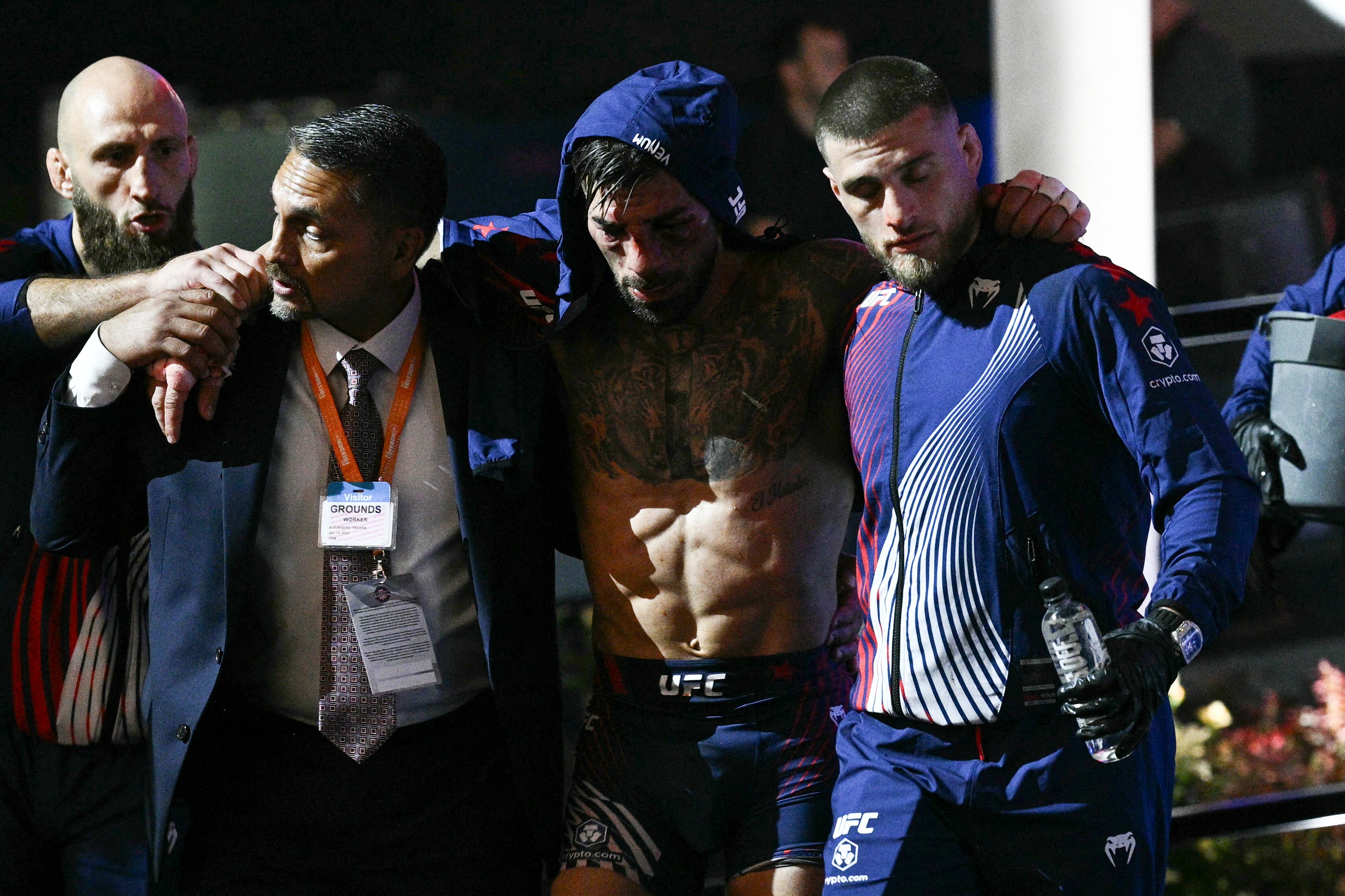 Ilia Topuria (centre) after his defeat by Justin Gaethje at the White House