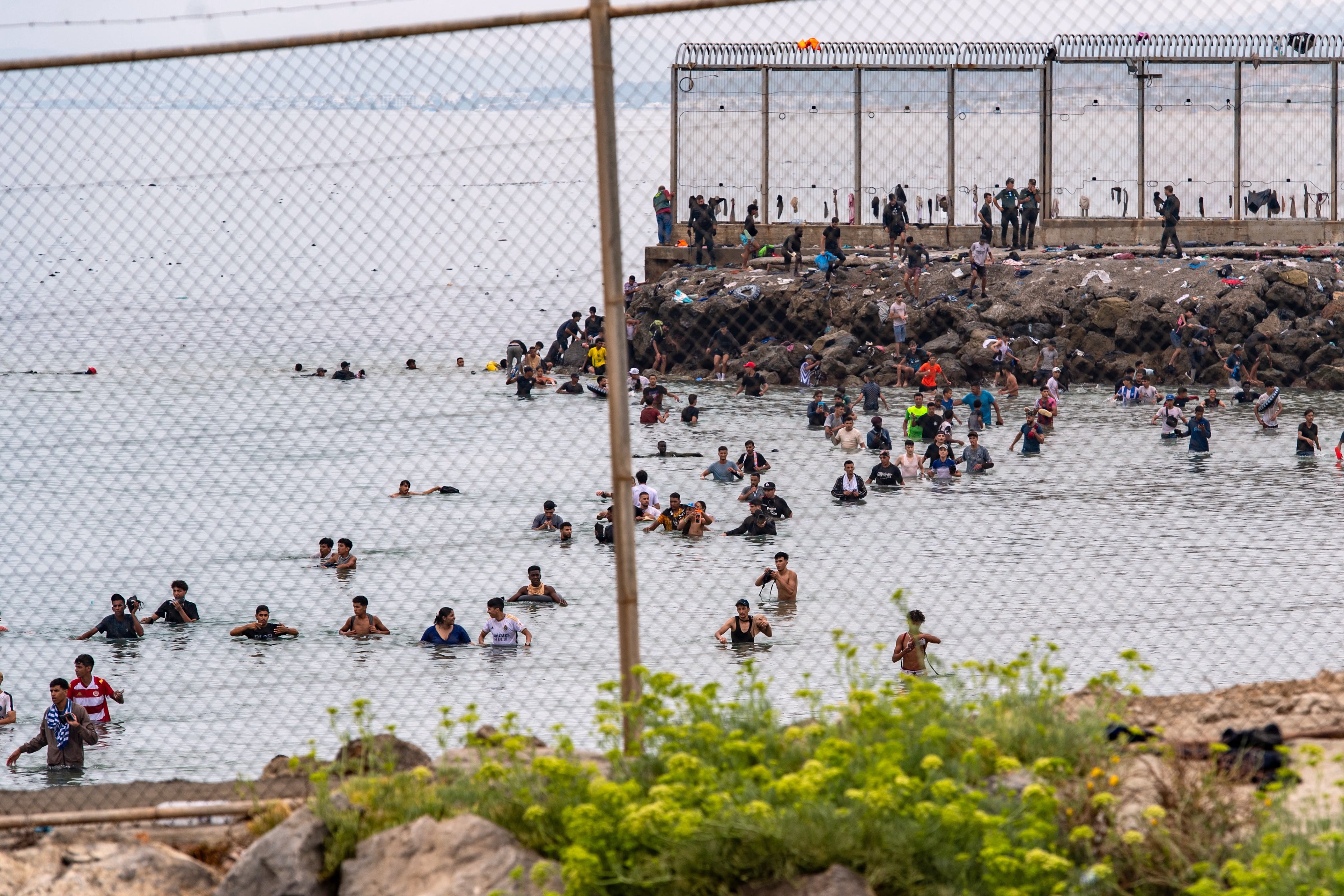 Of the 60,000 people who crossed between Thursday and Friday morning, some 45,000 had returned to Moroccan territory within hours after many spent the night on the streets of Ceuta amid startled locals and armed Spanish police and soldiers