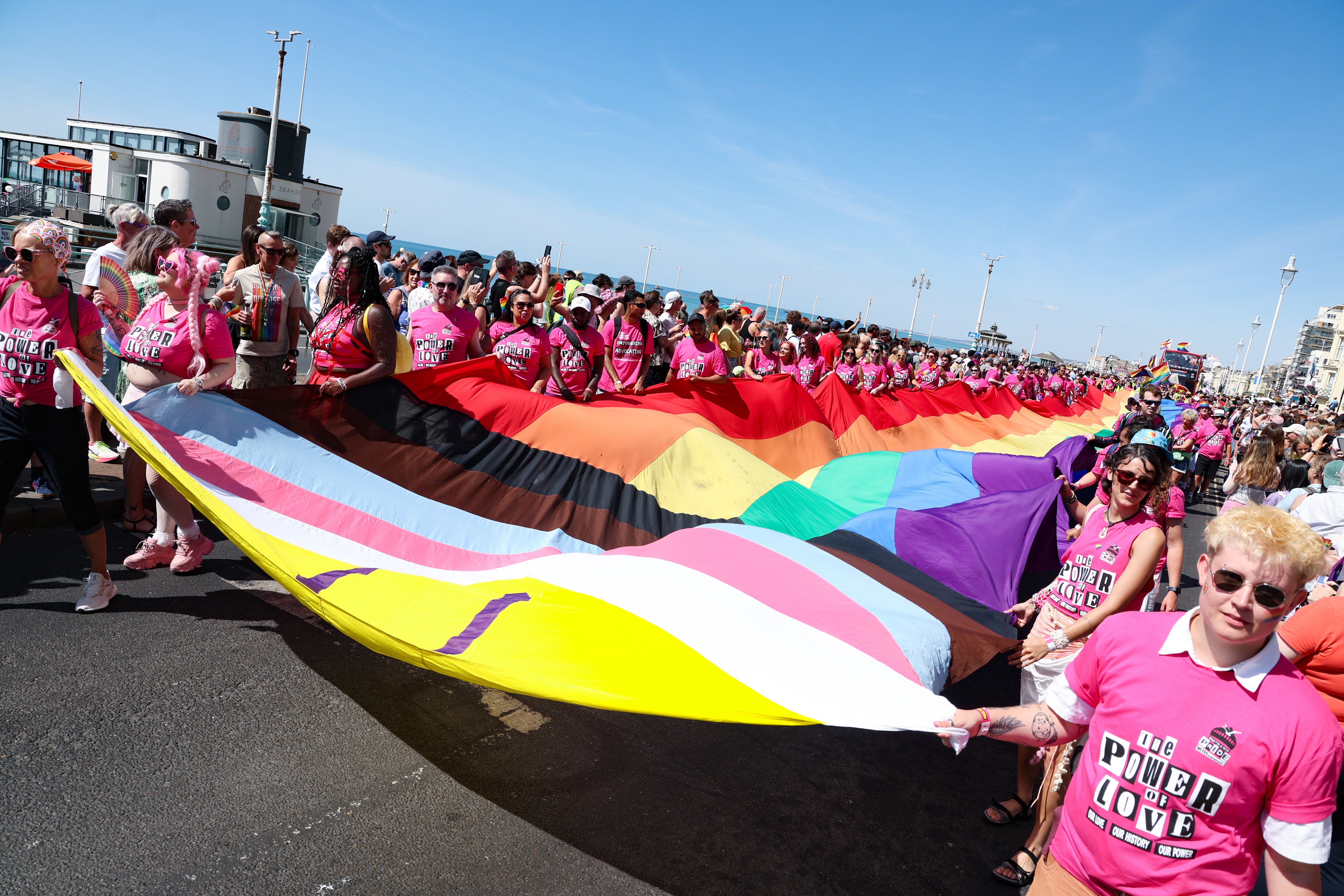 A huge Pride flag was strewn over the parade by marchers