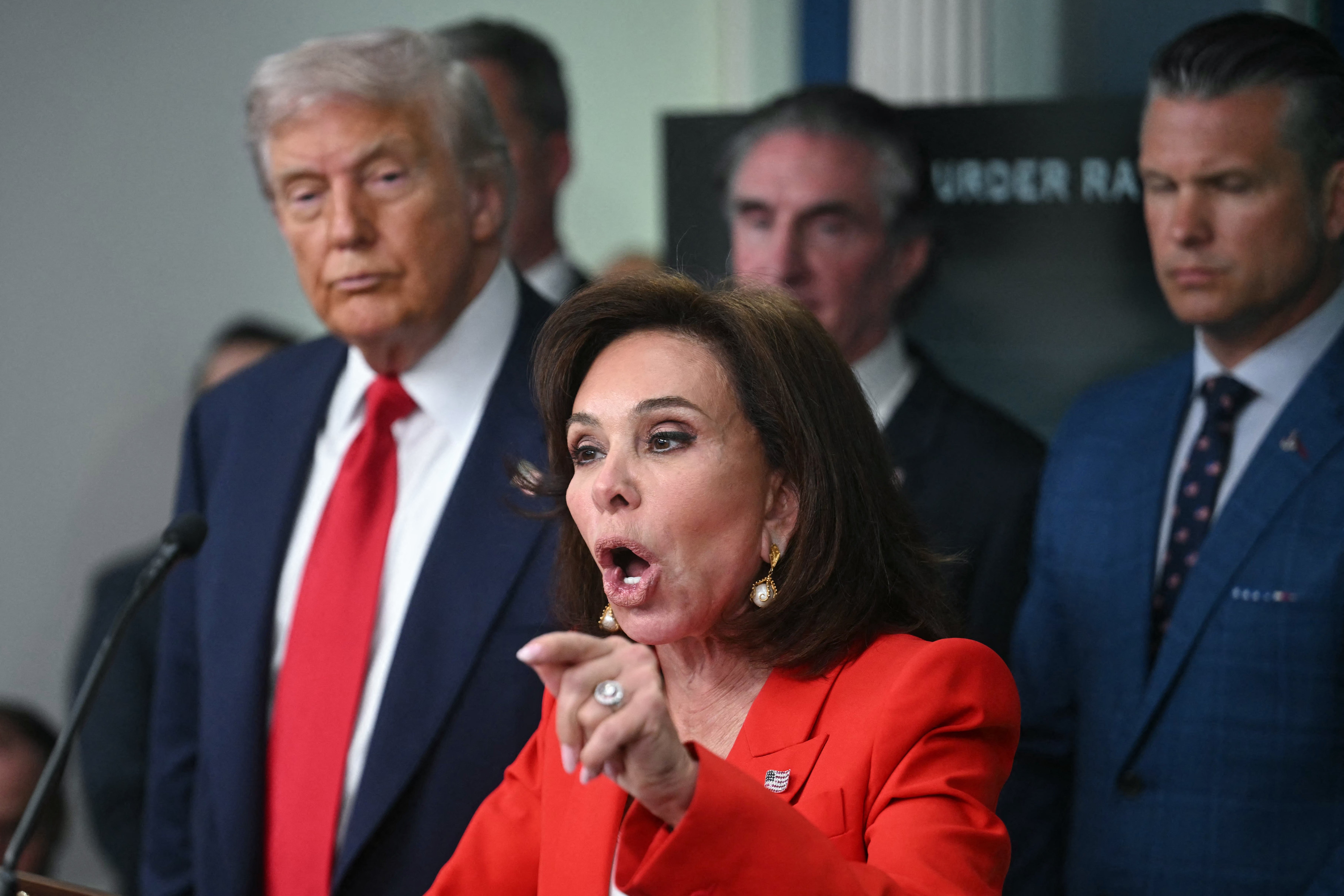 President Donald Trump with Jeanine Pirro, whom he accused of ‘choking’ for dropping the Reflecting Pool case (AFP/Getty)