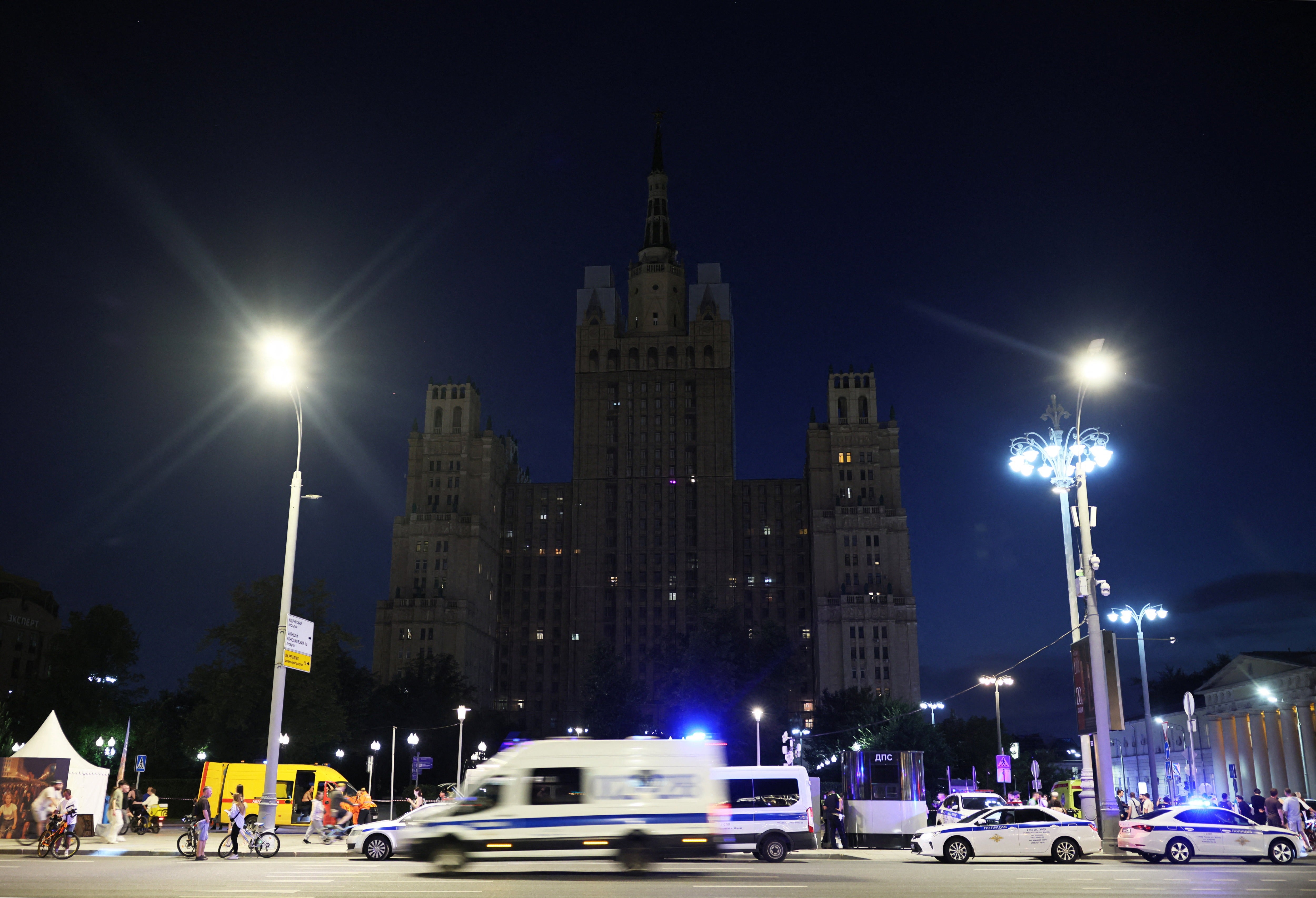 Police vehicles at the site of an explosion at a restaurant in central Moscow