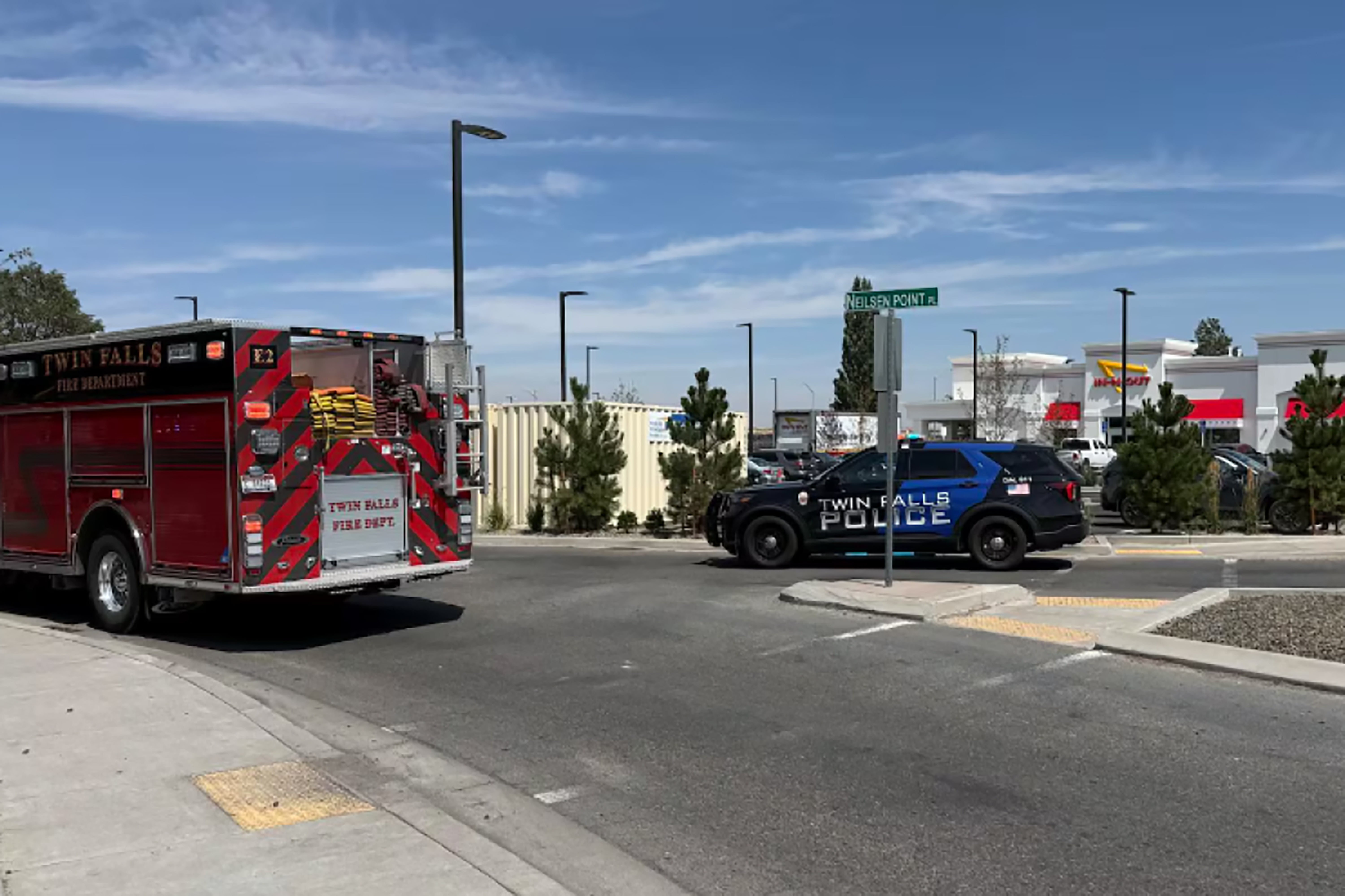 This image provided by KMVT shows the scene of a shooting that started at an In-N-Out Burger restaurant, Saturday, Aug. 1, 2026 in Twin Falls, Idaho. (KMVT via AP)