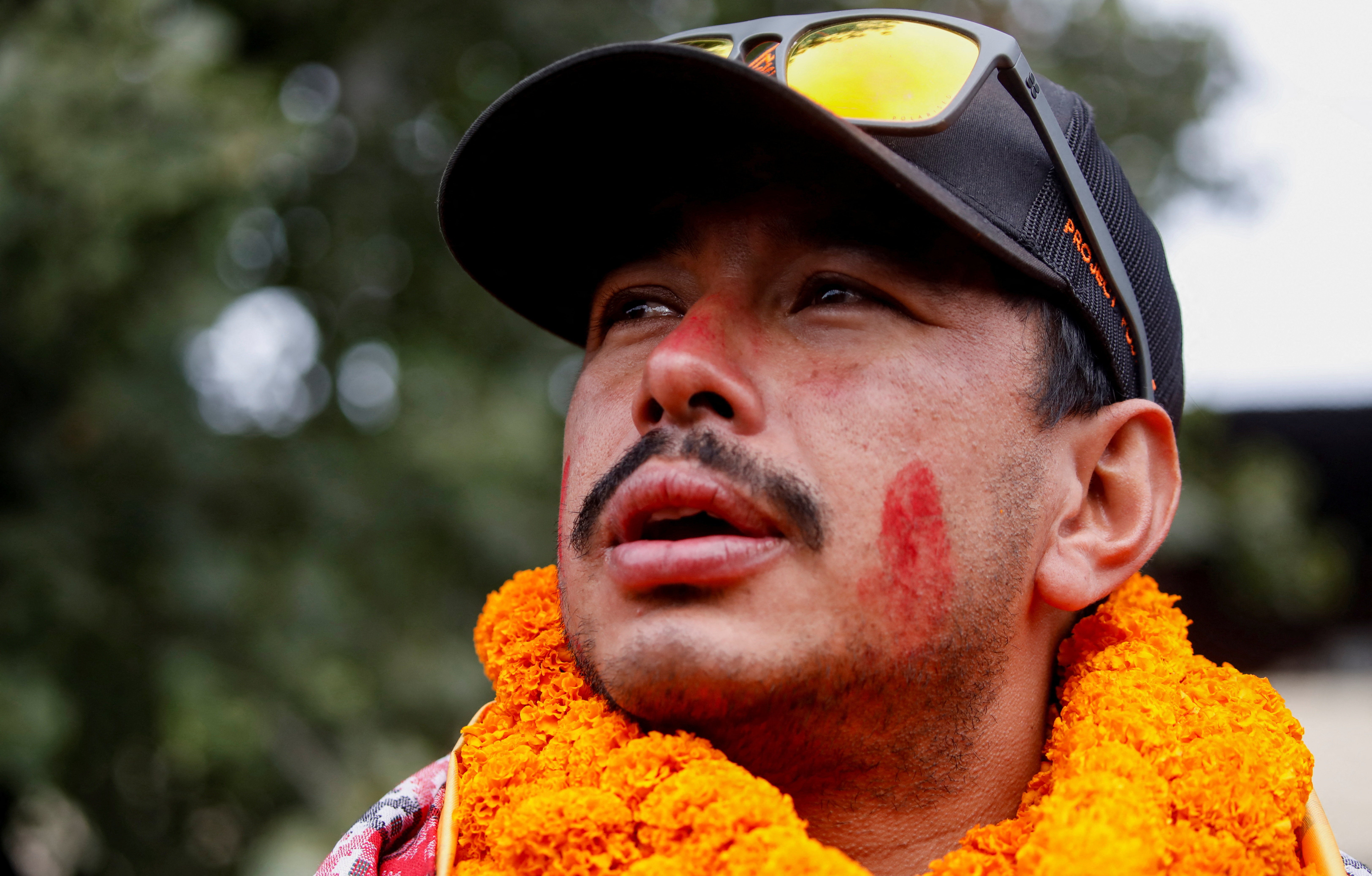 Nirmal Purja, who became the fastest person to summit the world's 14 highest mountains, speaks with the media upon his arrival at Tribhuvan International Airport in Kathmandu, Nepal