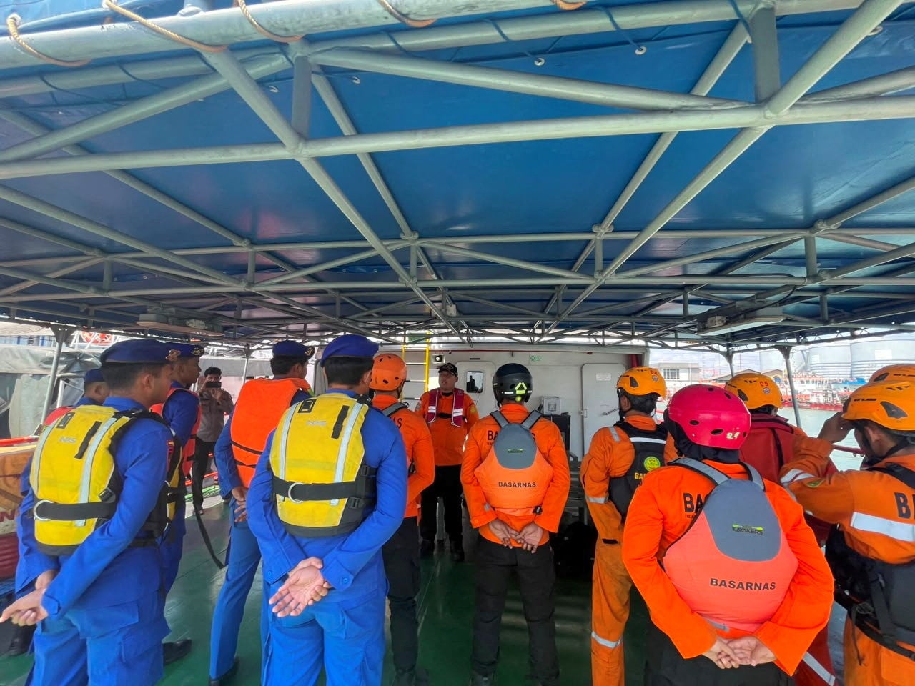 Rescue officers prepare for a search and rescue operation after a deadly fire on a ferry, which caught fire off Indonesia's Madura island, in Surabaya (Reuters)